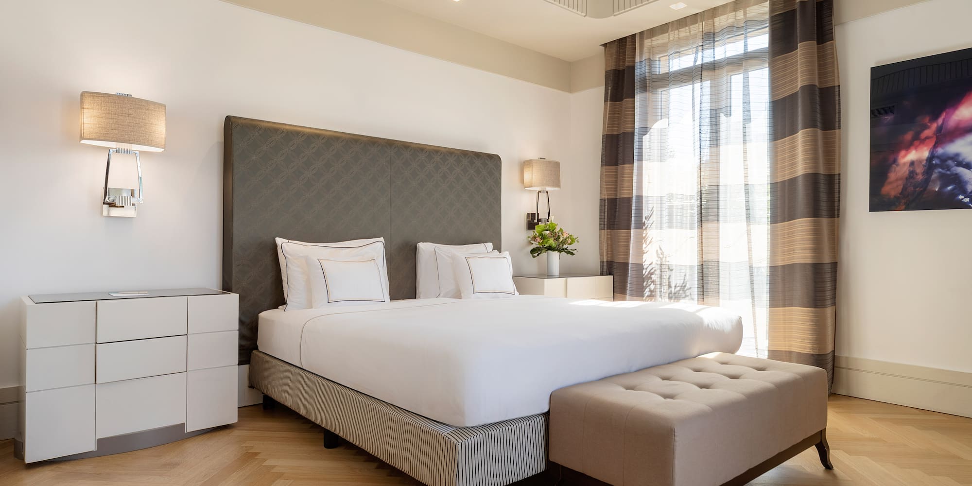 a bed with a bench in a room