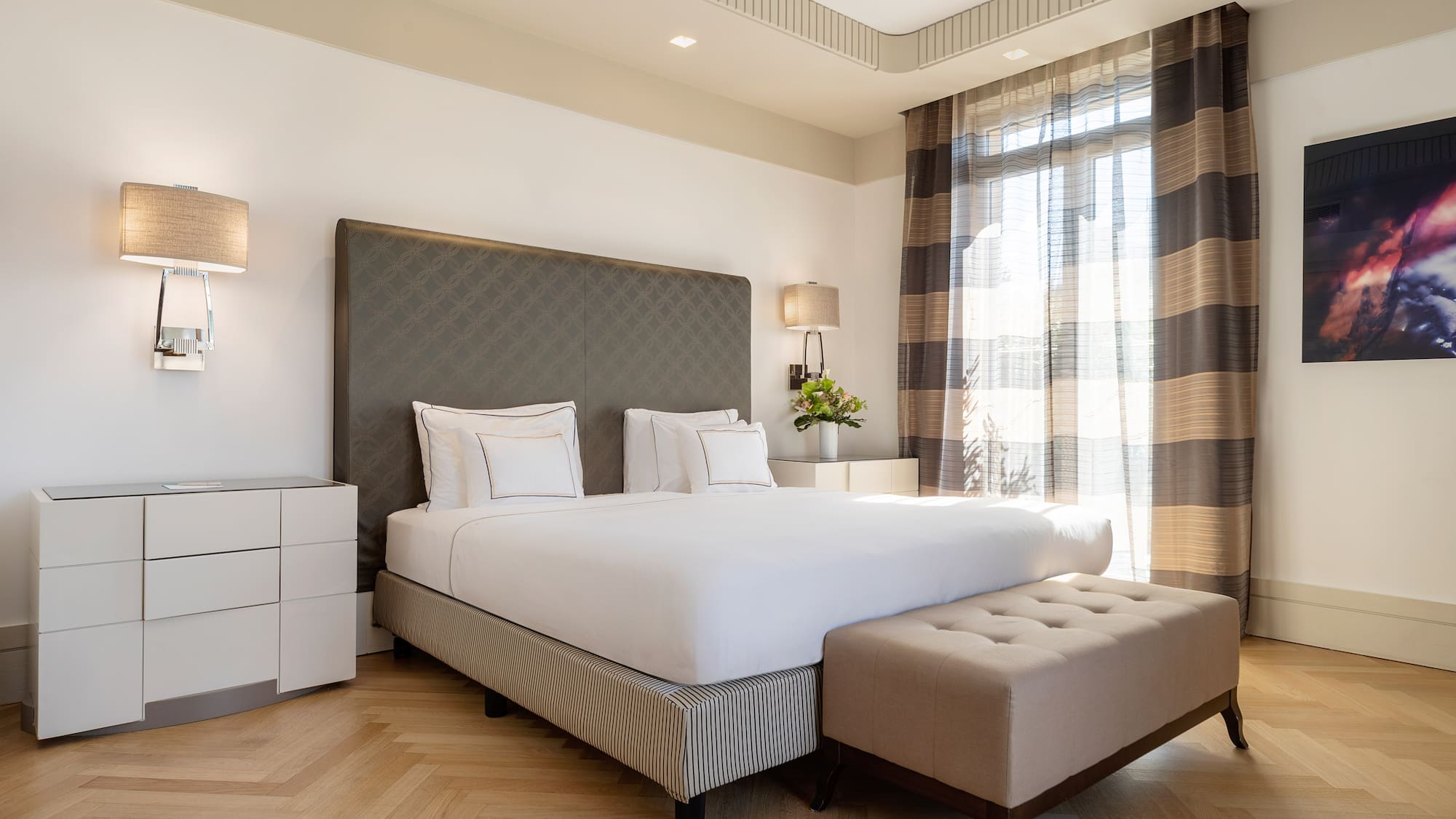 a bed with a bench in a room