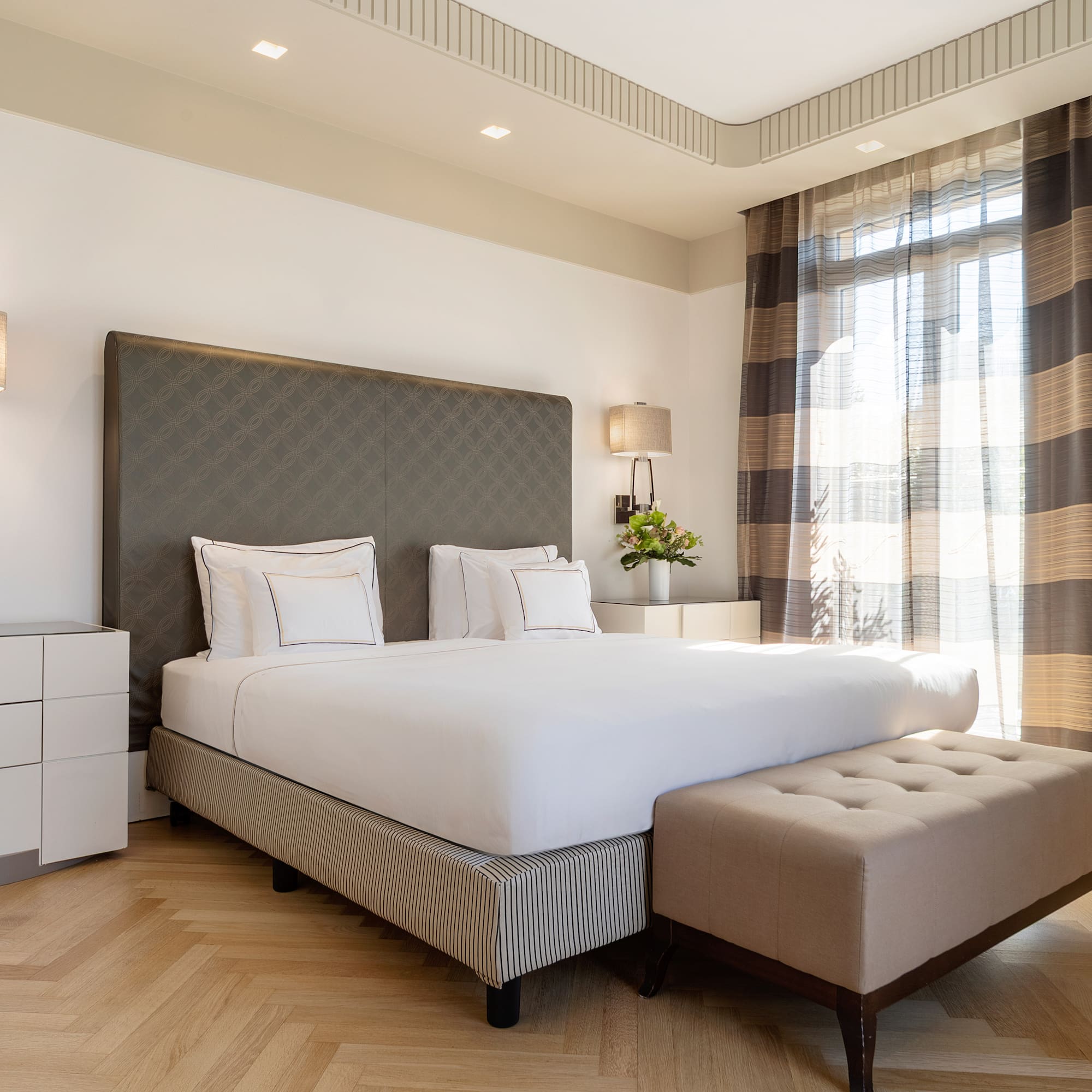 a bed with a bench in a room