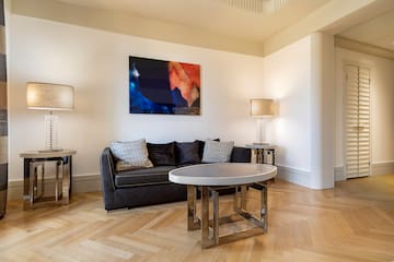 a living room with a couch and a table