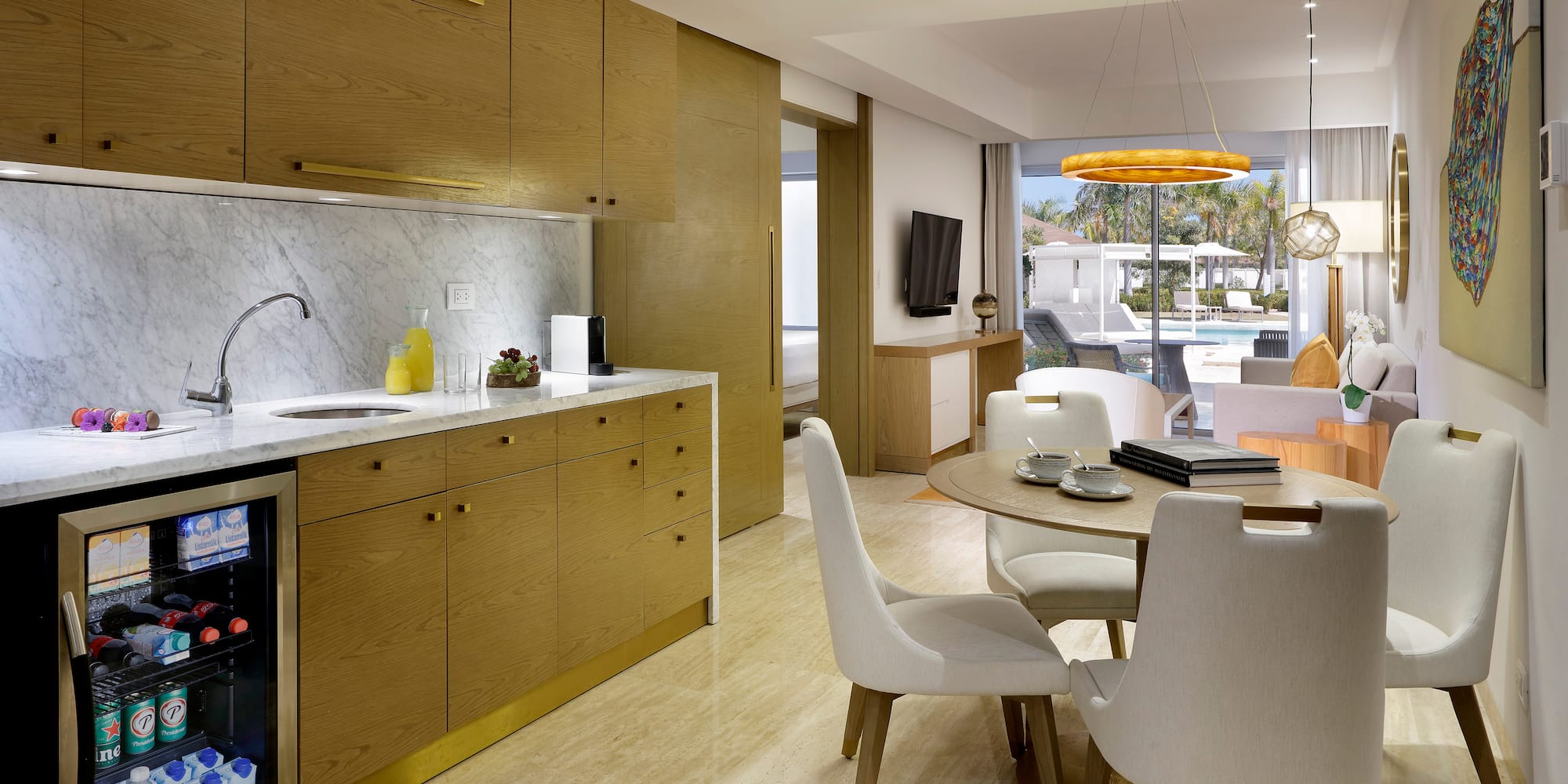 a kitchen and dining room with a table and chairs