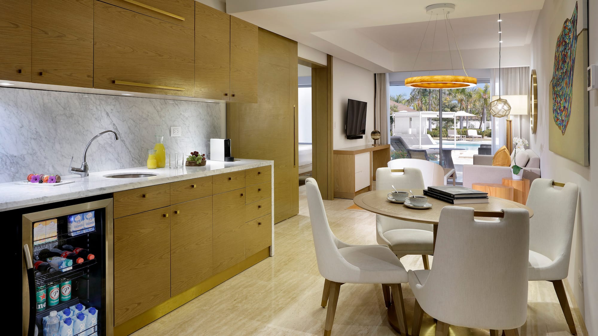 a kitchen and dining room with a table and chairs