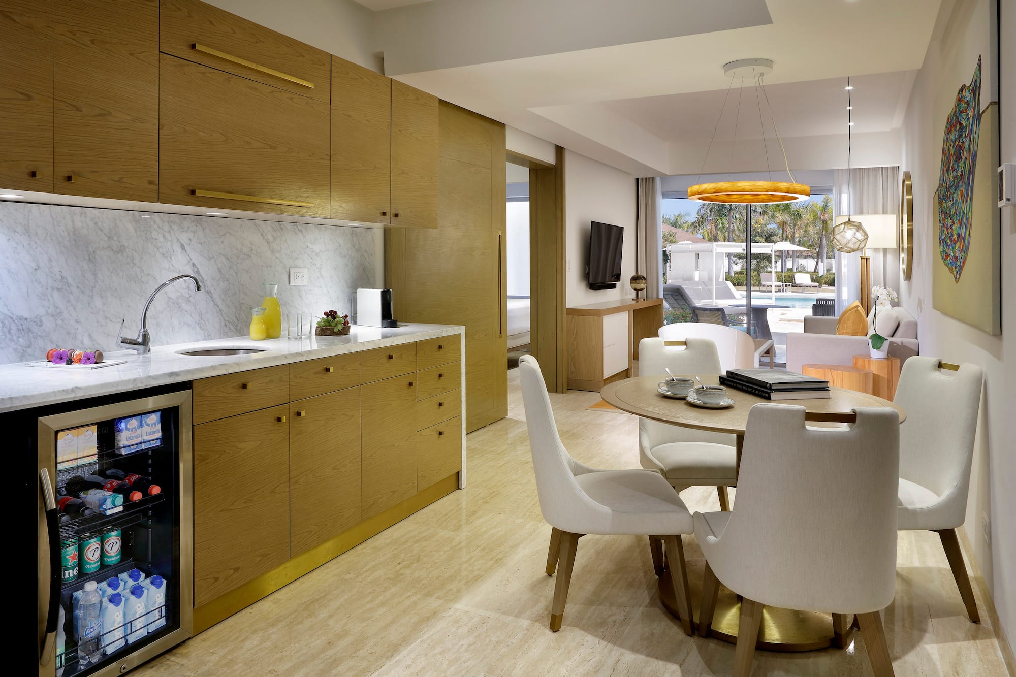 a kitchen and dining room with a table and chairs