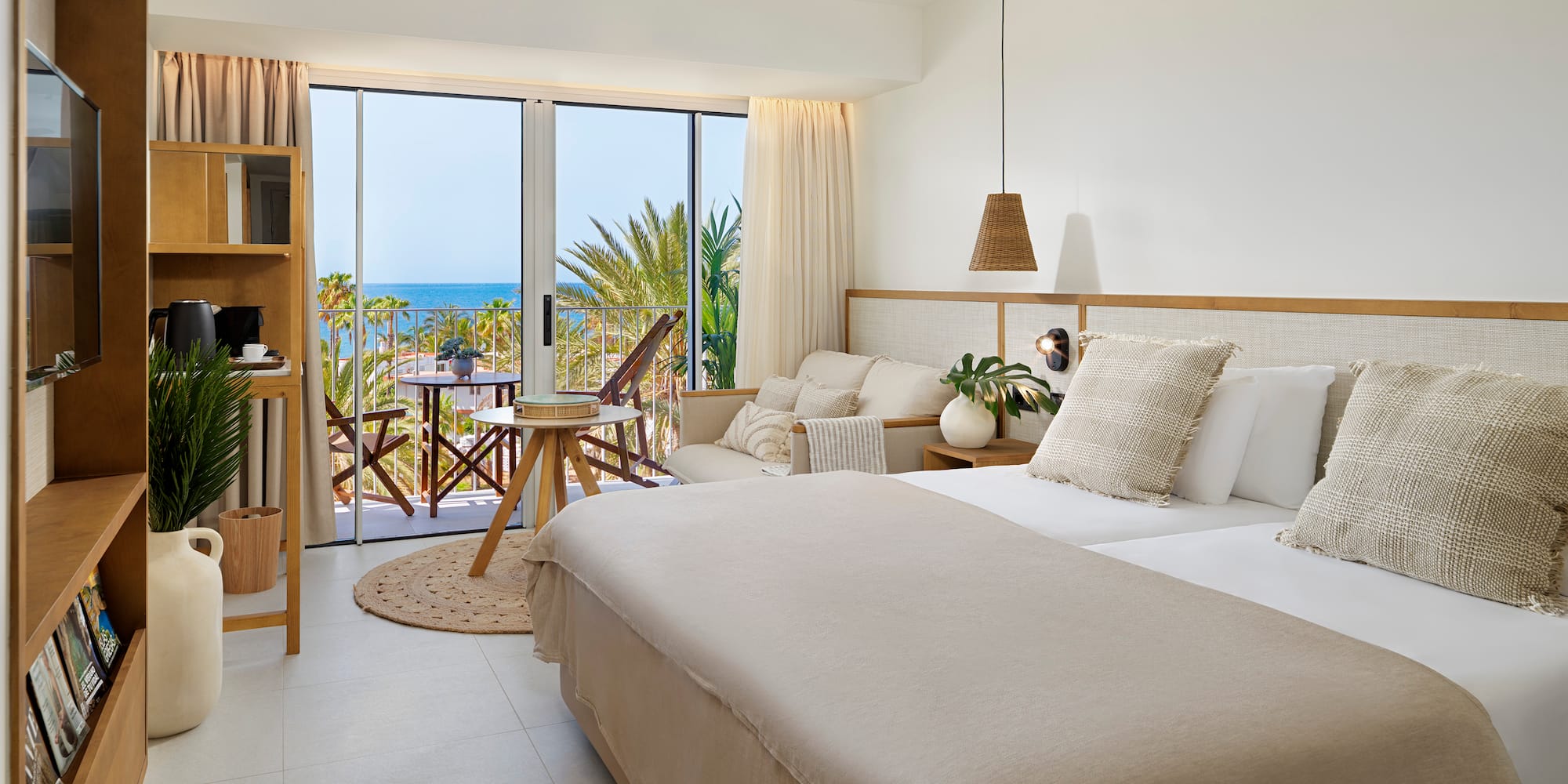 a bedroom with a large bed and a large window