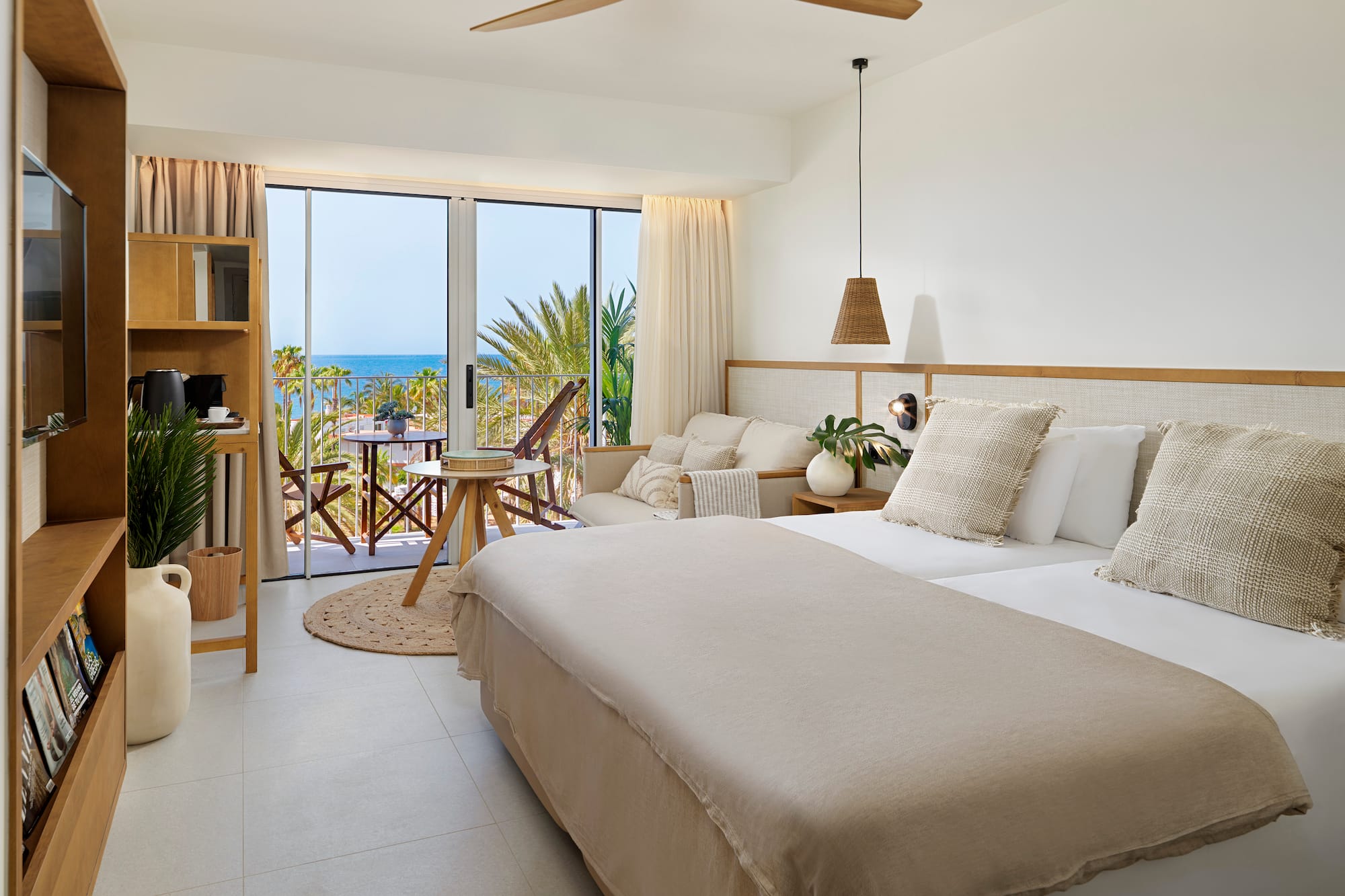 a bedroom with a large bed and a large window