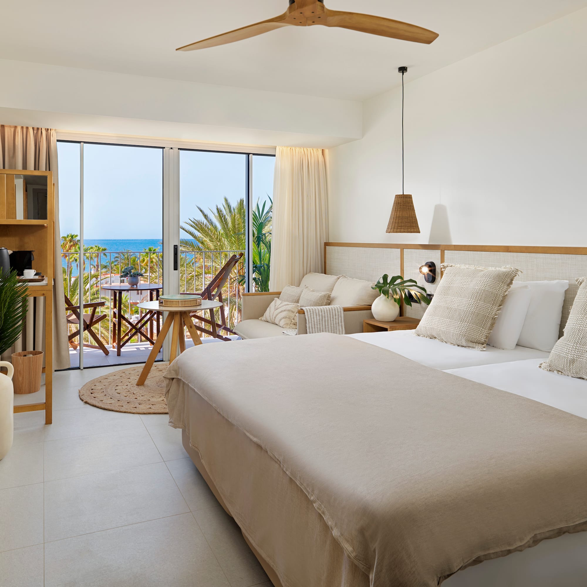 a bedroom with a large bed and a large window