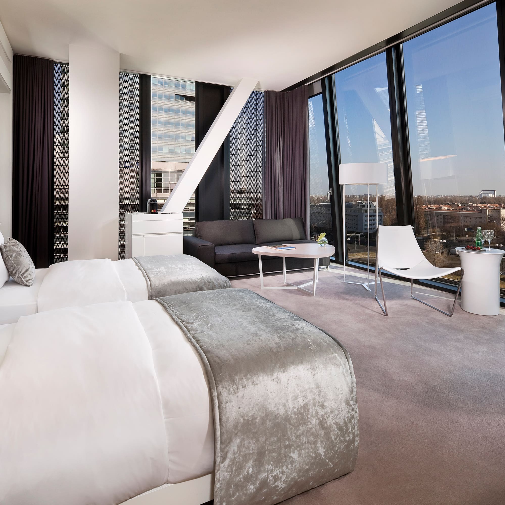 a room with two beds and a couch