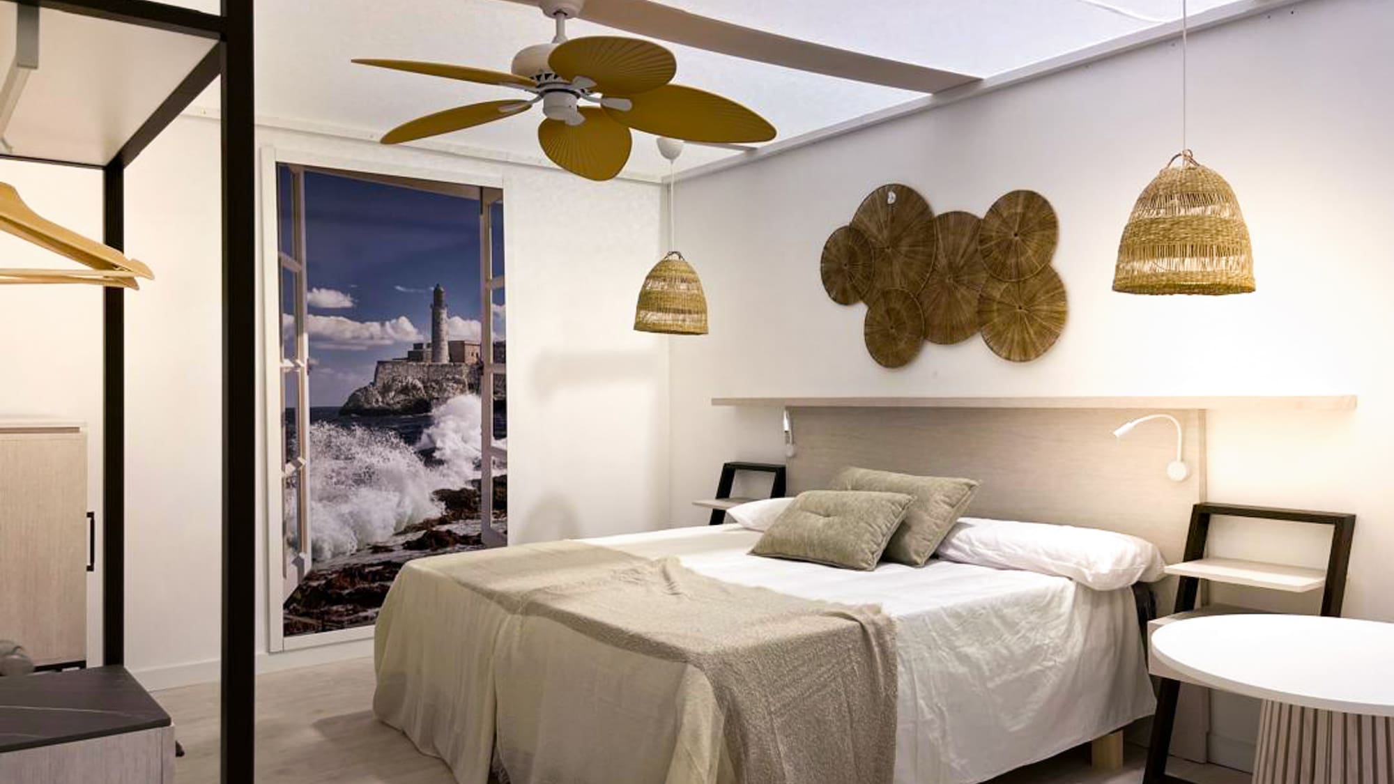a bedroom with a bed and ceiling fan