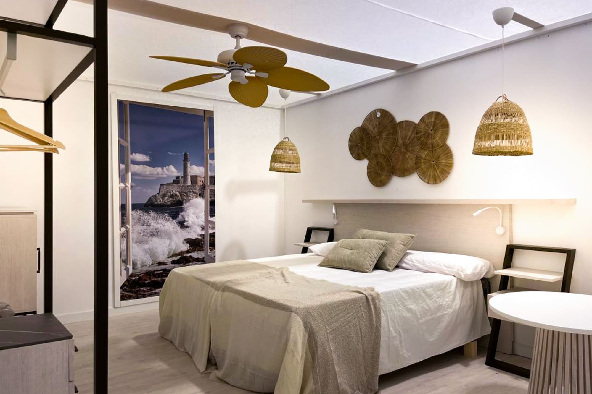 a bedroom with a bed and ceiling fan