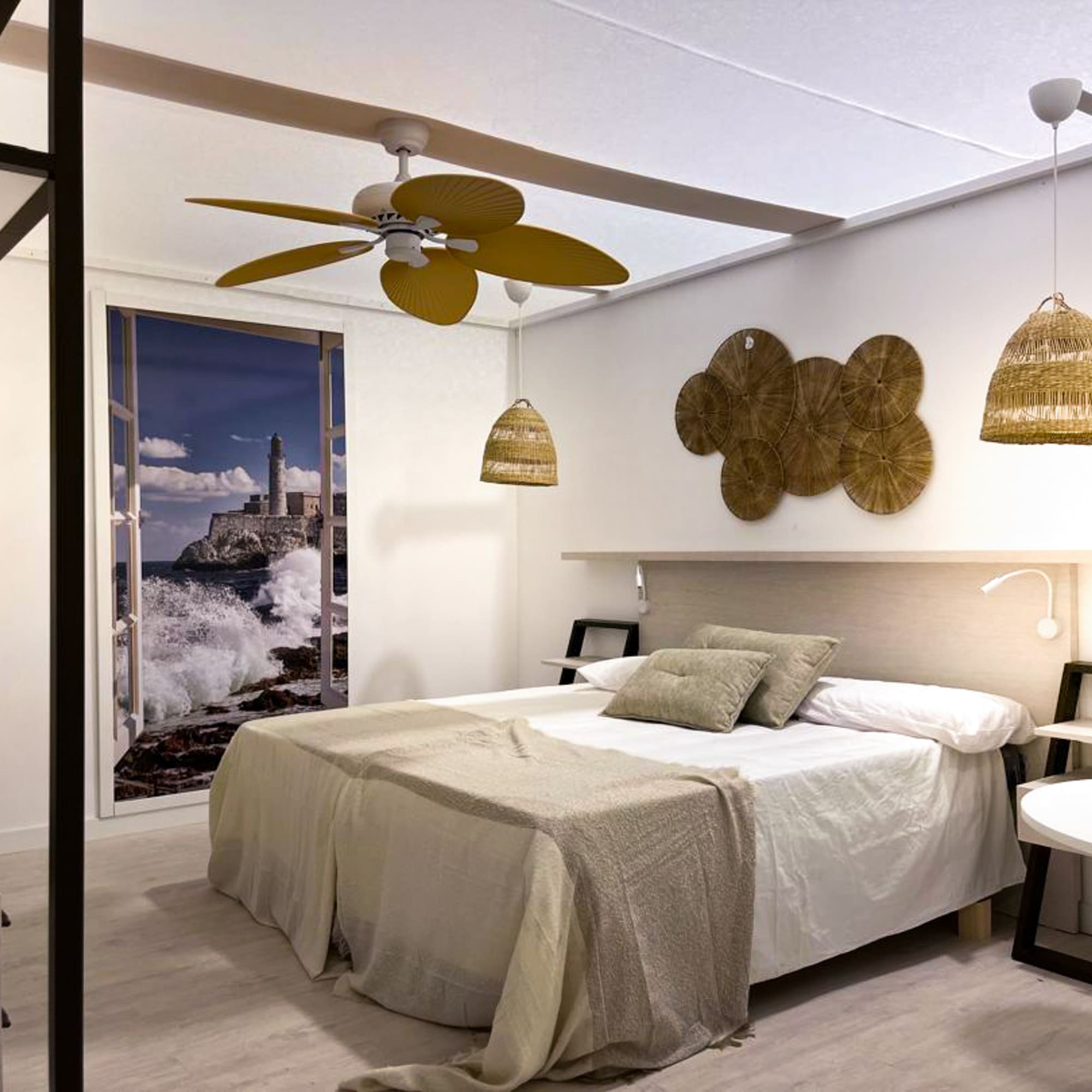 a bedroom with a bed and ceiling fan