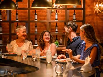 a group of people sitting at a table
