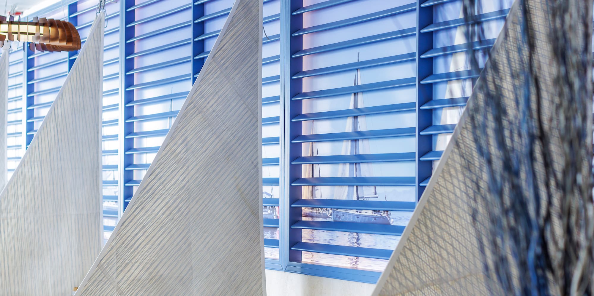 a room with chairs and a window