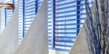 a room with chairs and a window