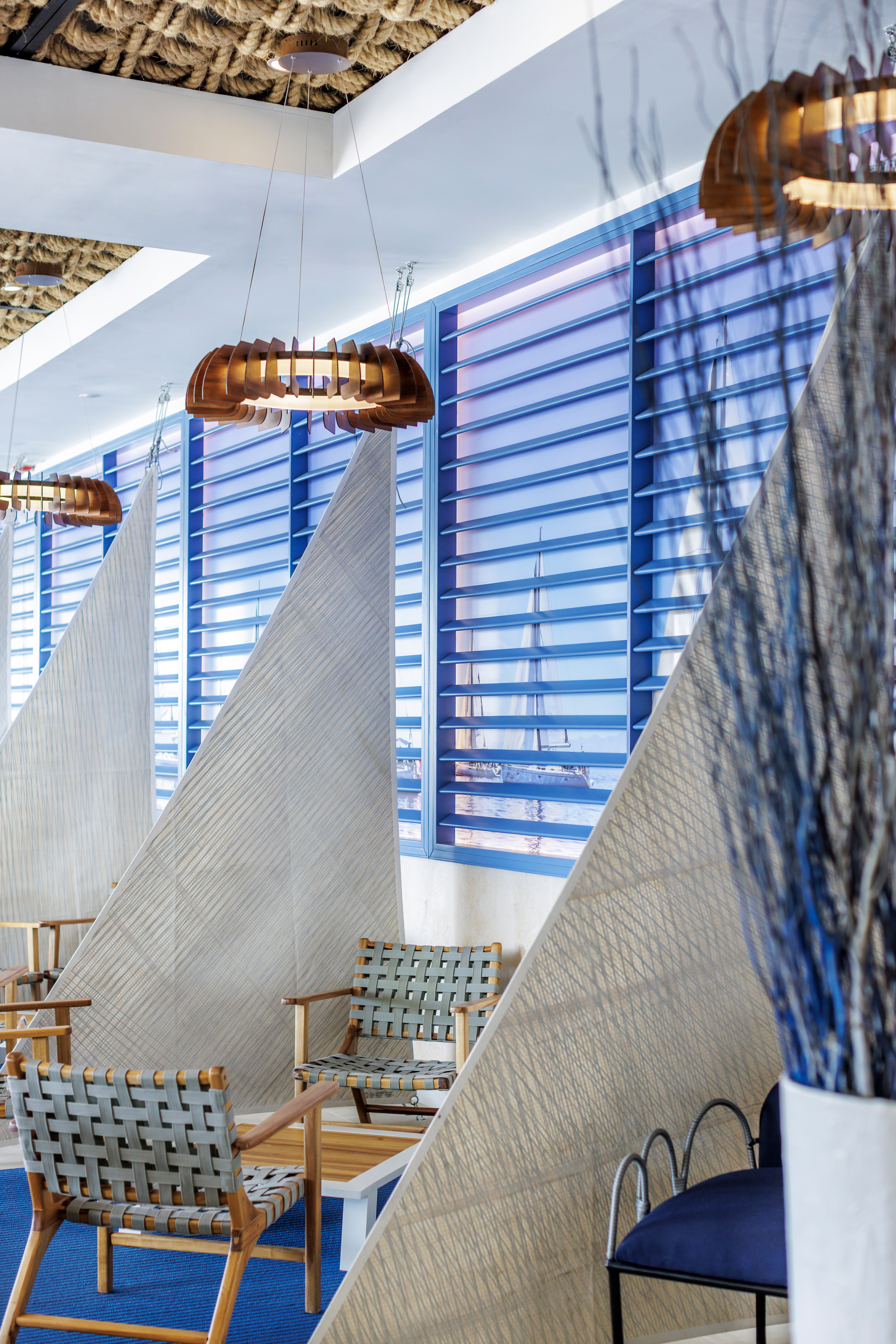 a room with chairs and a window