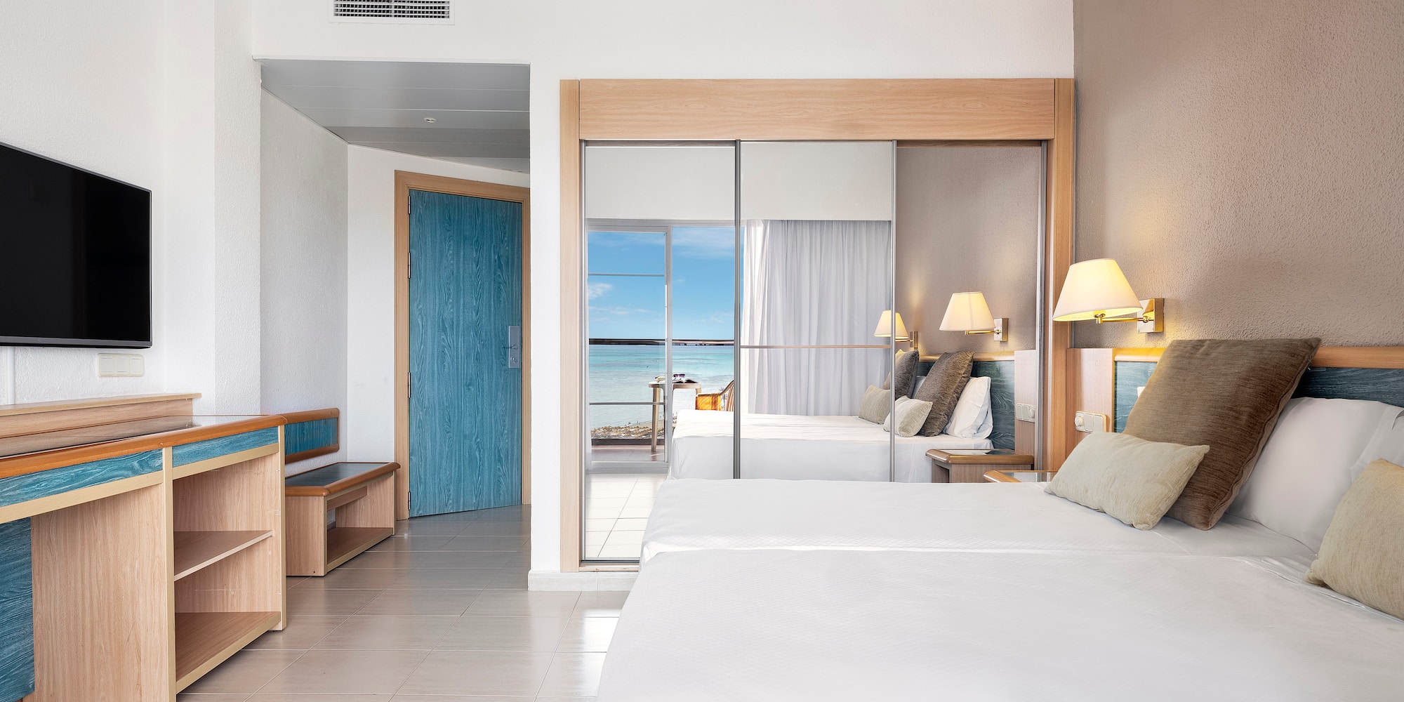 a room with a bed and a sliding door