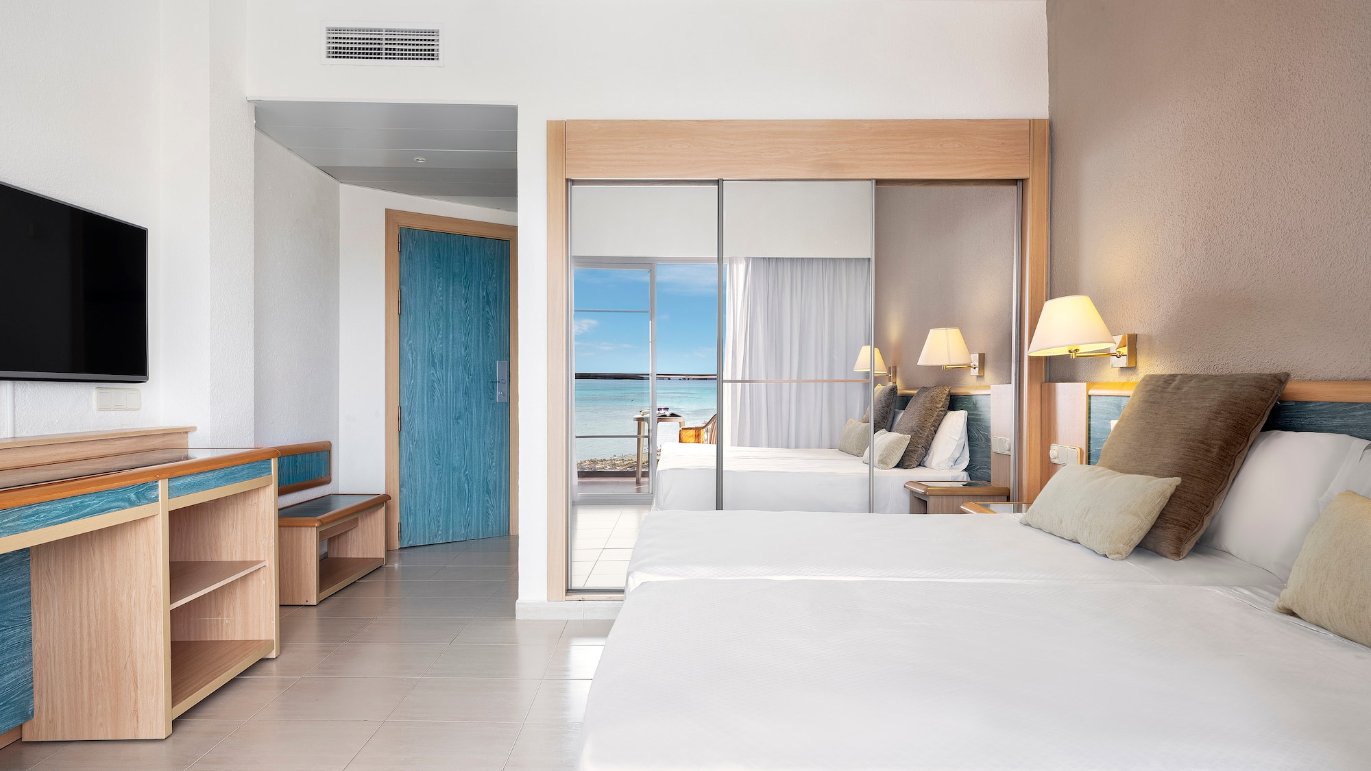 a room with a bed and a sliding door