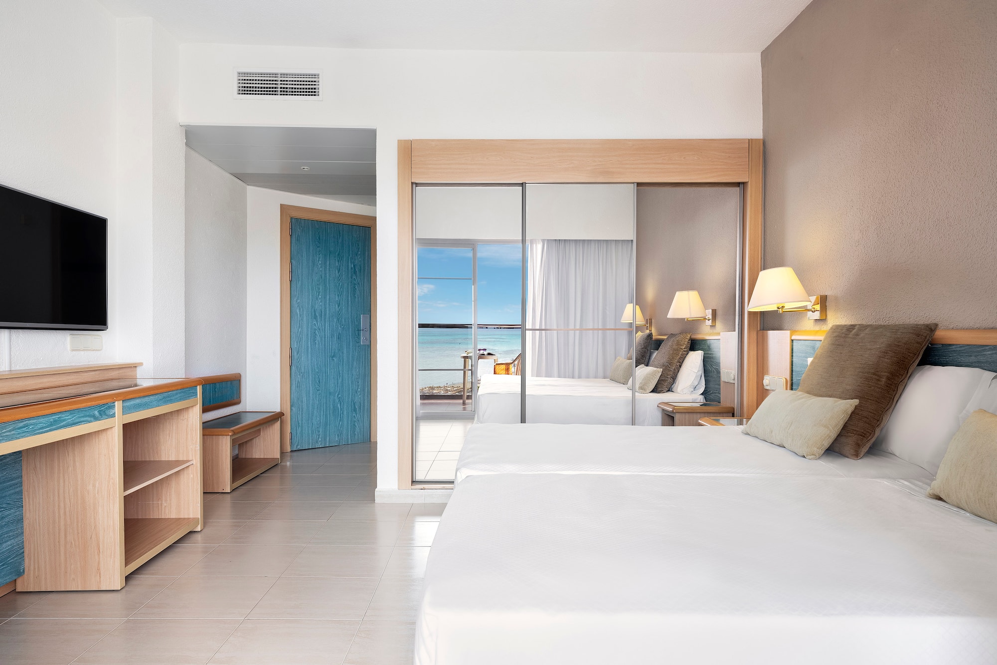 a room with a bed and a sliding door