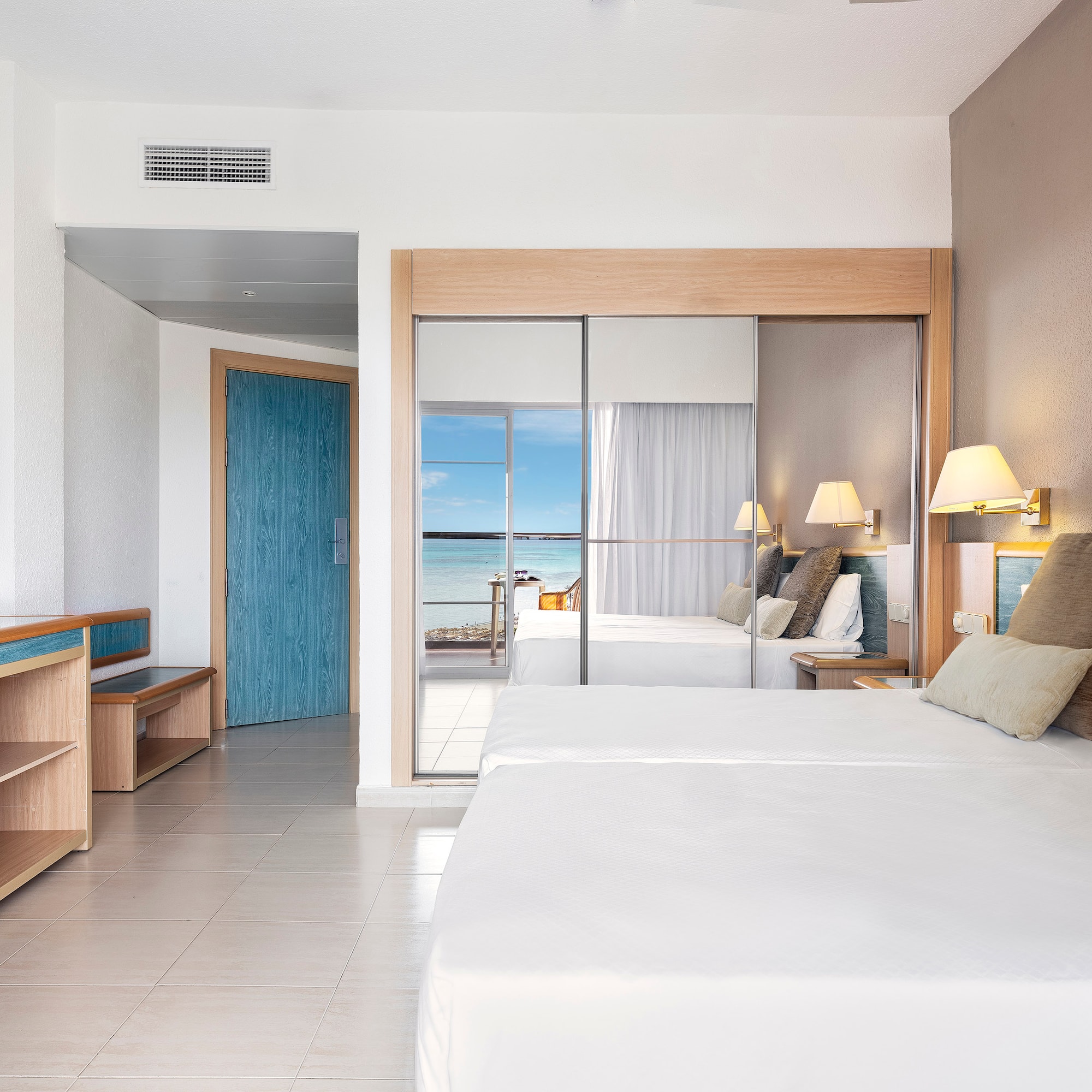 a room with a bed and a sliding door