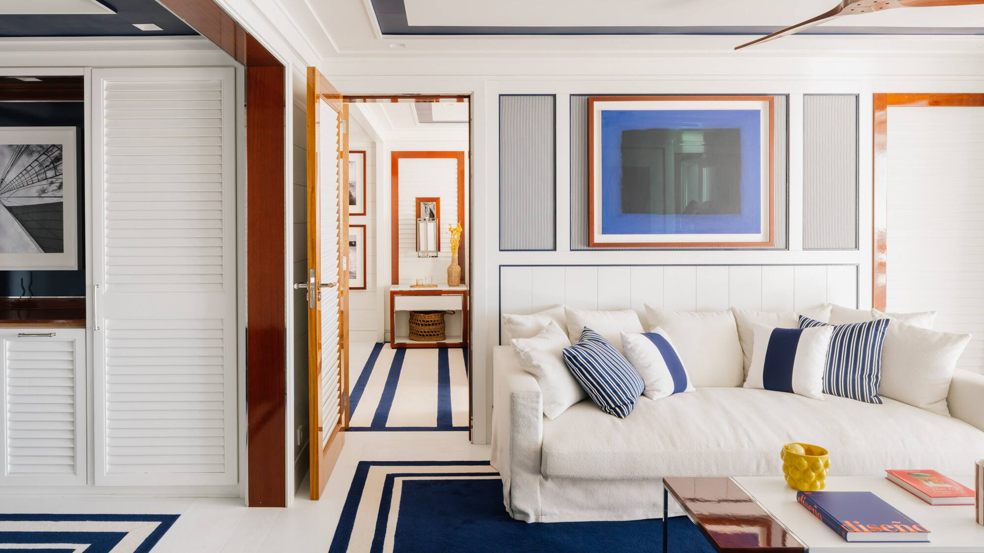 a room with a couch and a rug