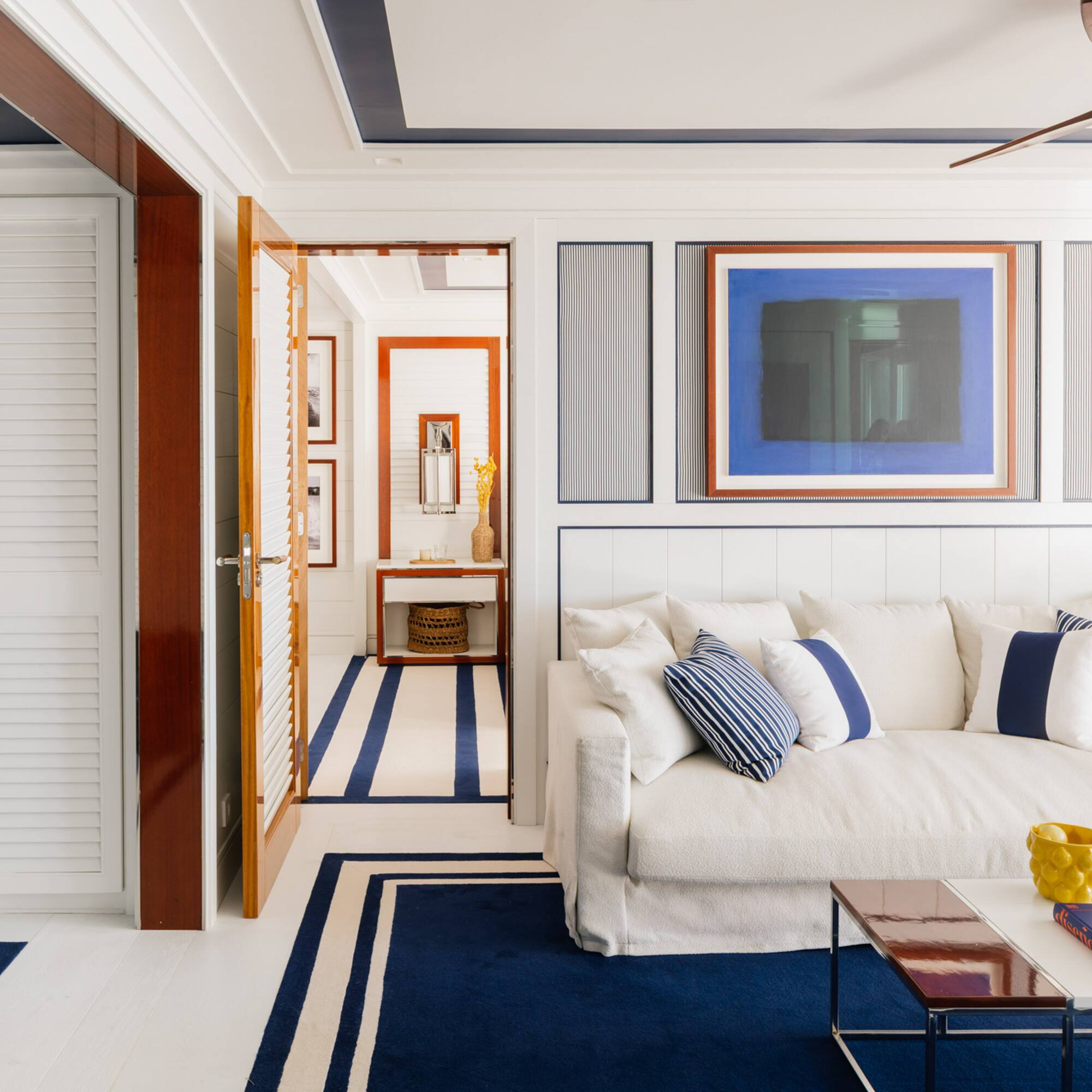 a room with a couch and a rug