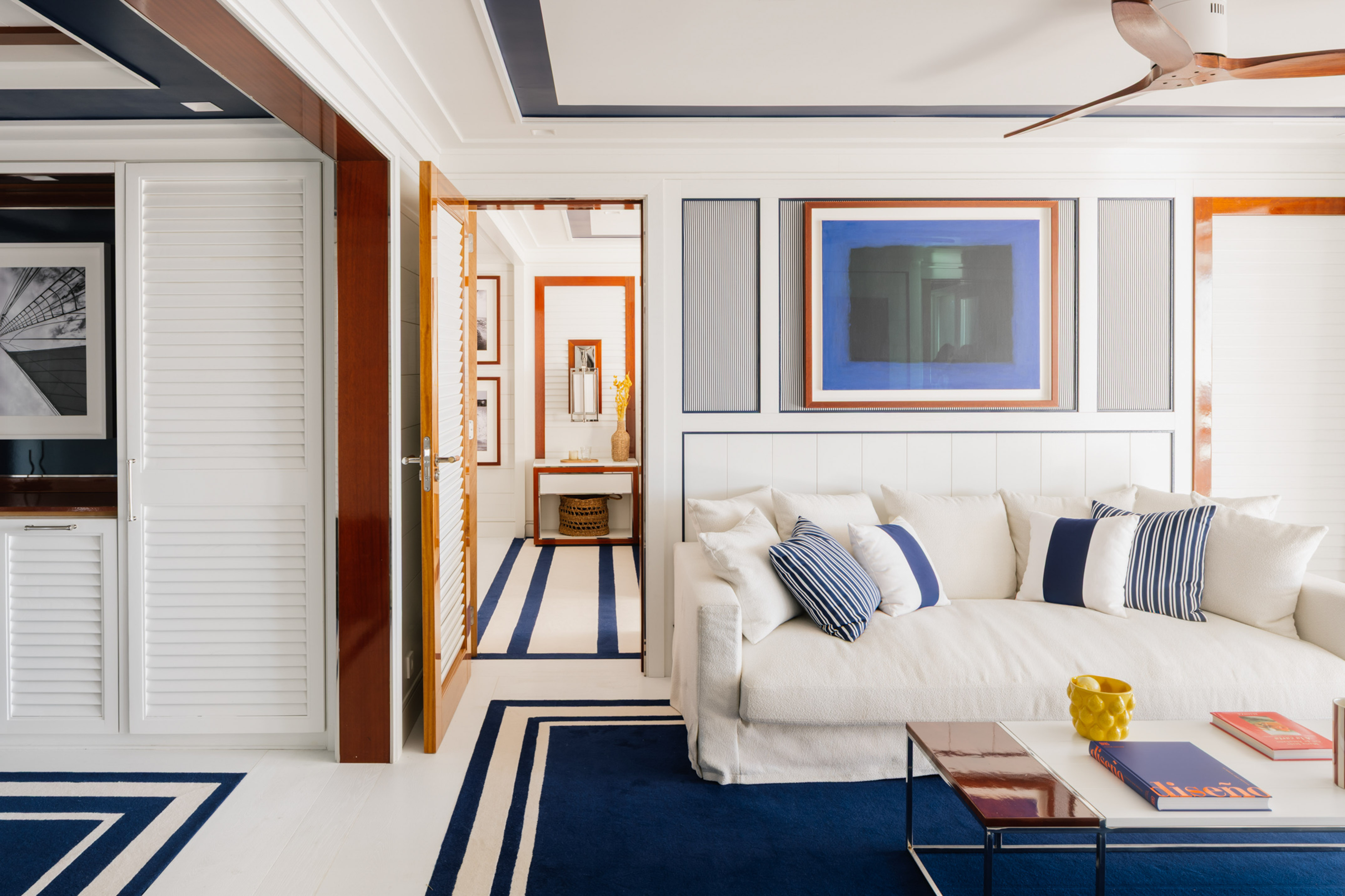 a room with a couch and a rug