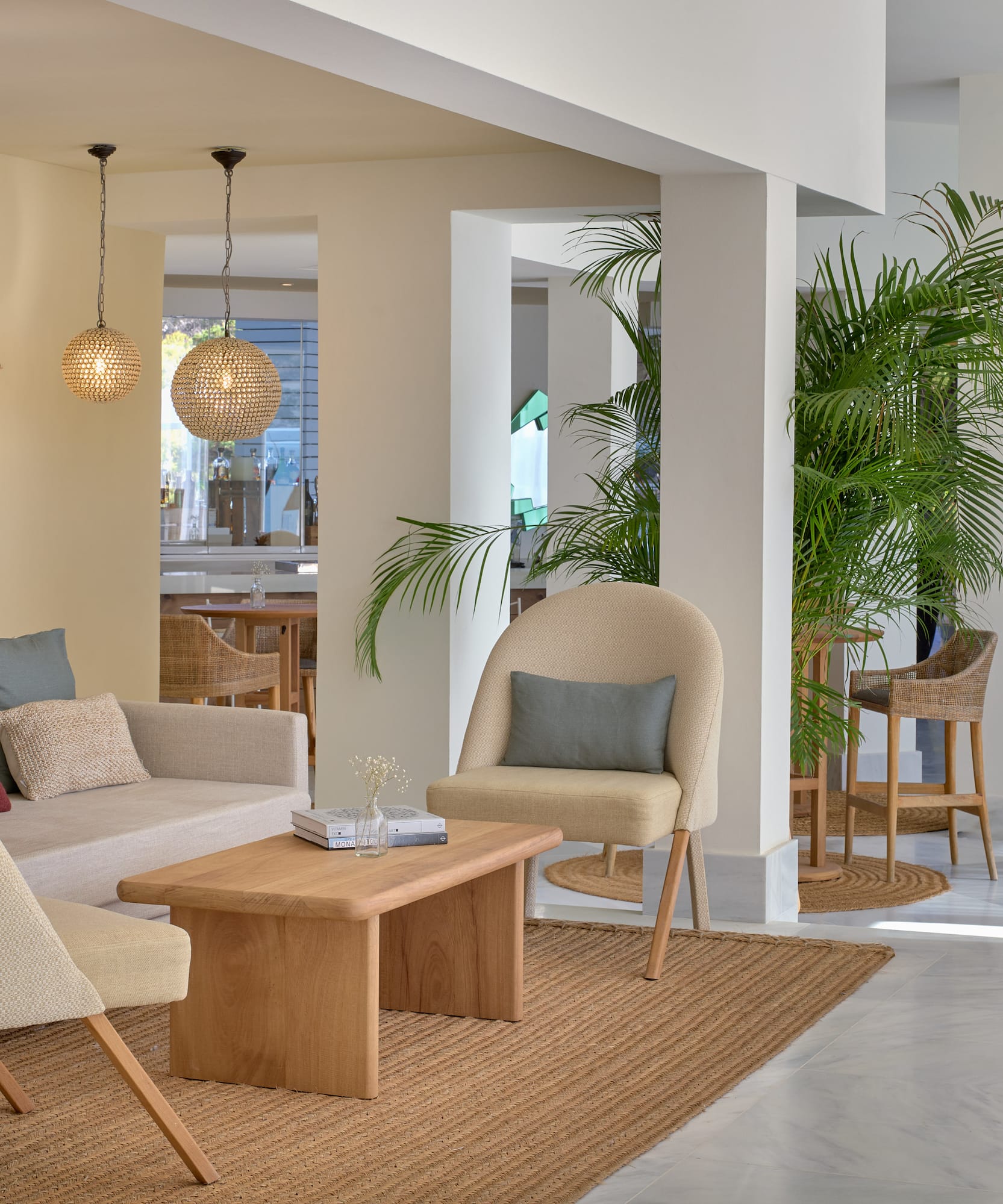 a room with a couch and chairs