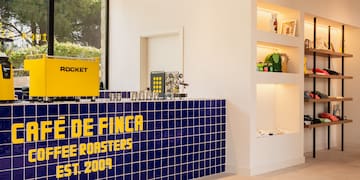 a blue and yellow counter with a sign on it