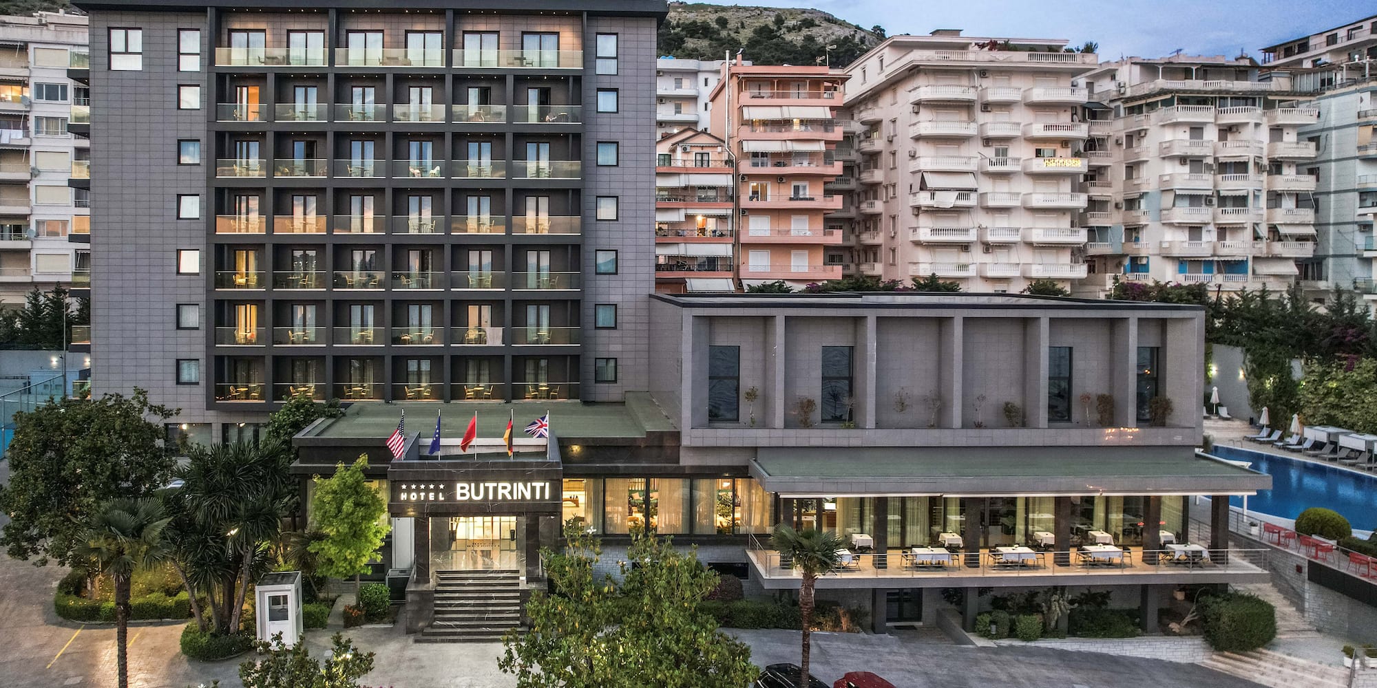 a building with many windows and a parking lot