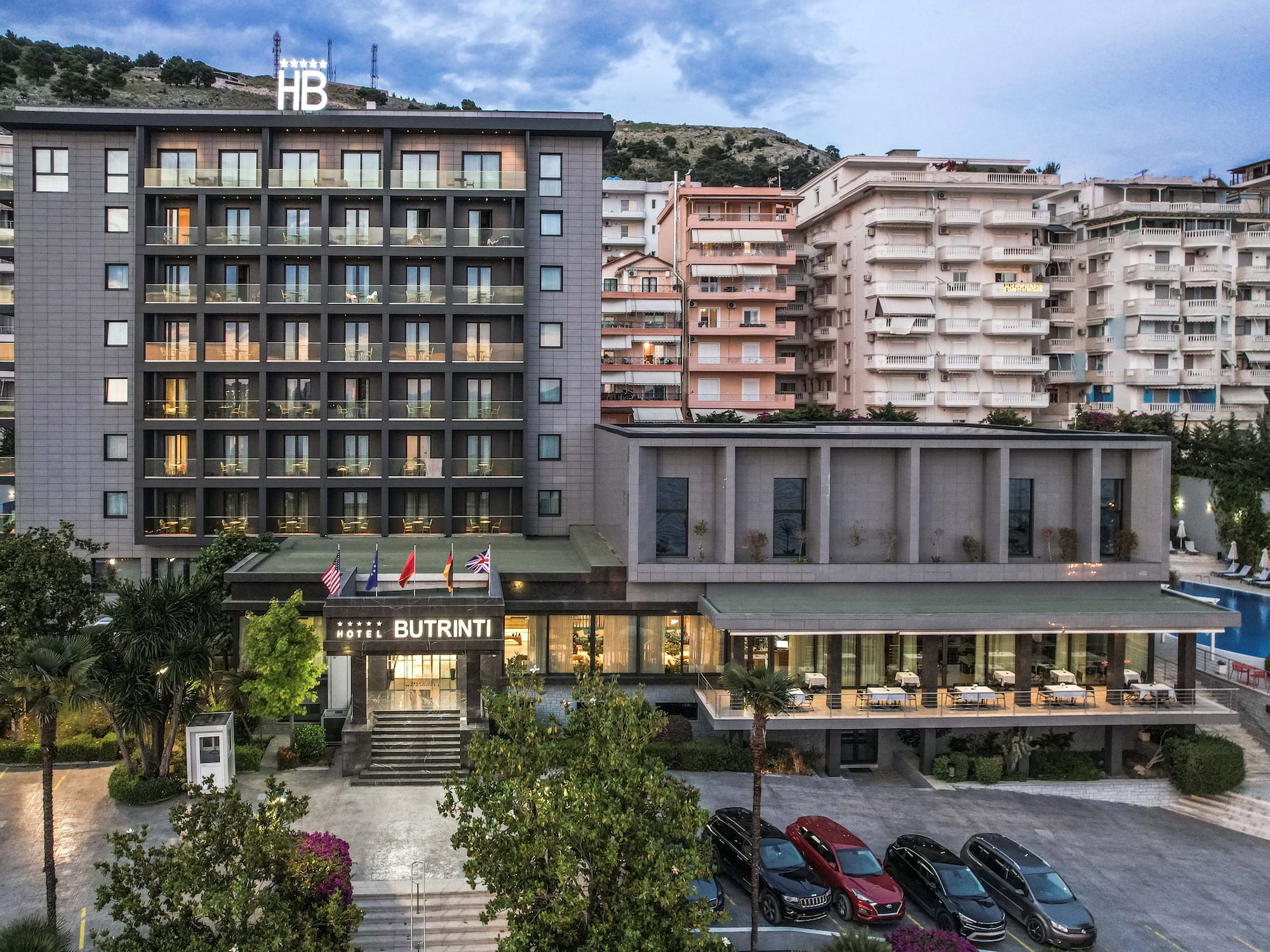 a building with many windows and a parking lot