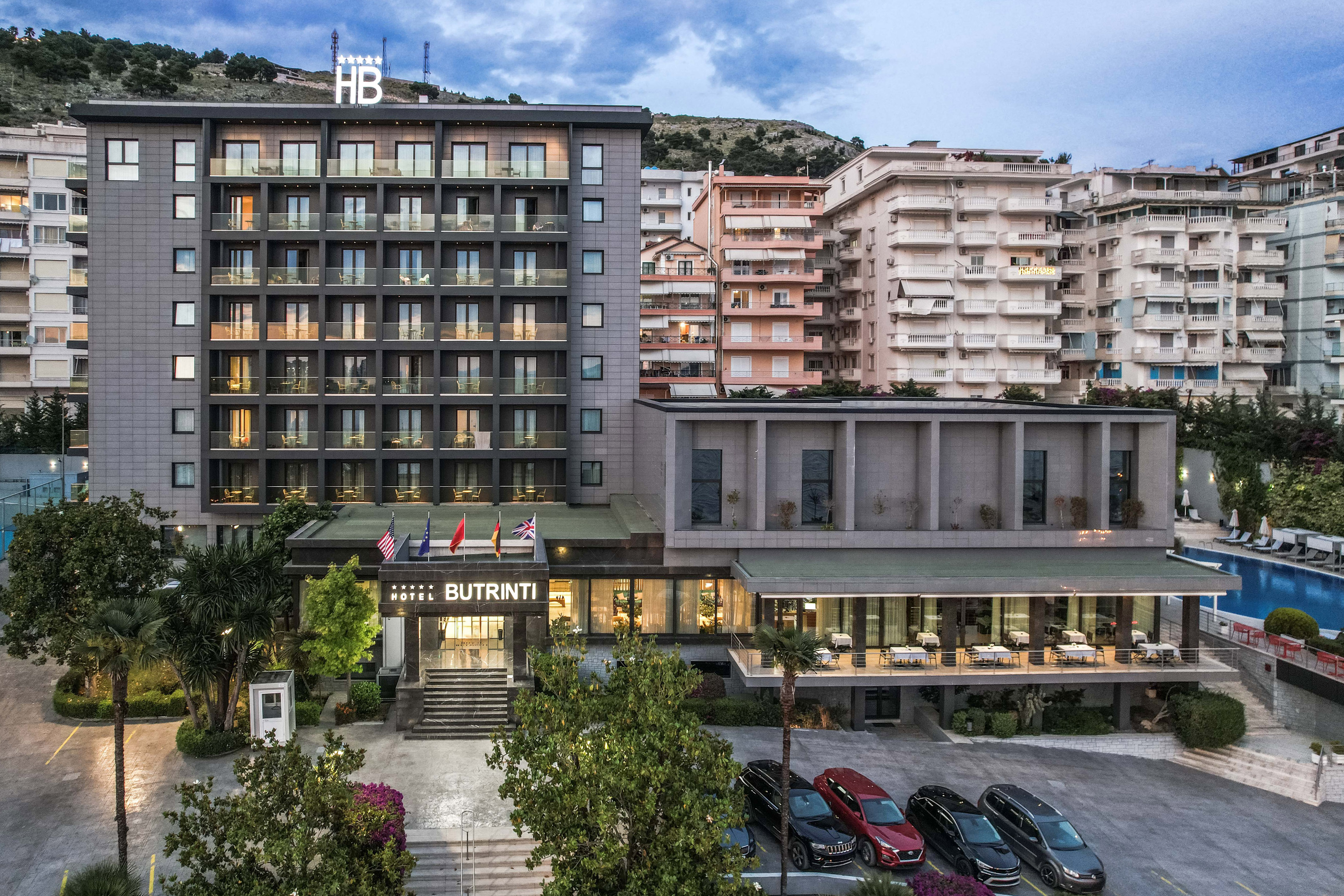 a building with many windows and a parking lot