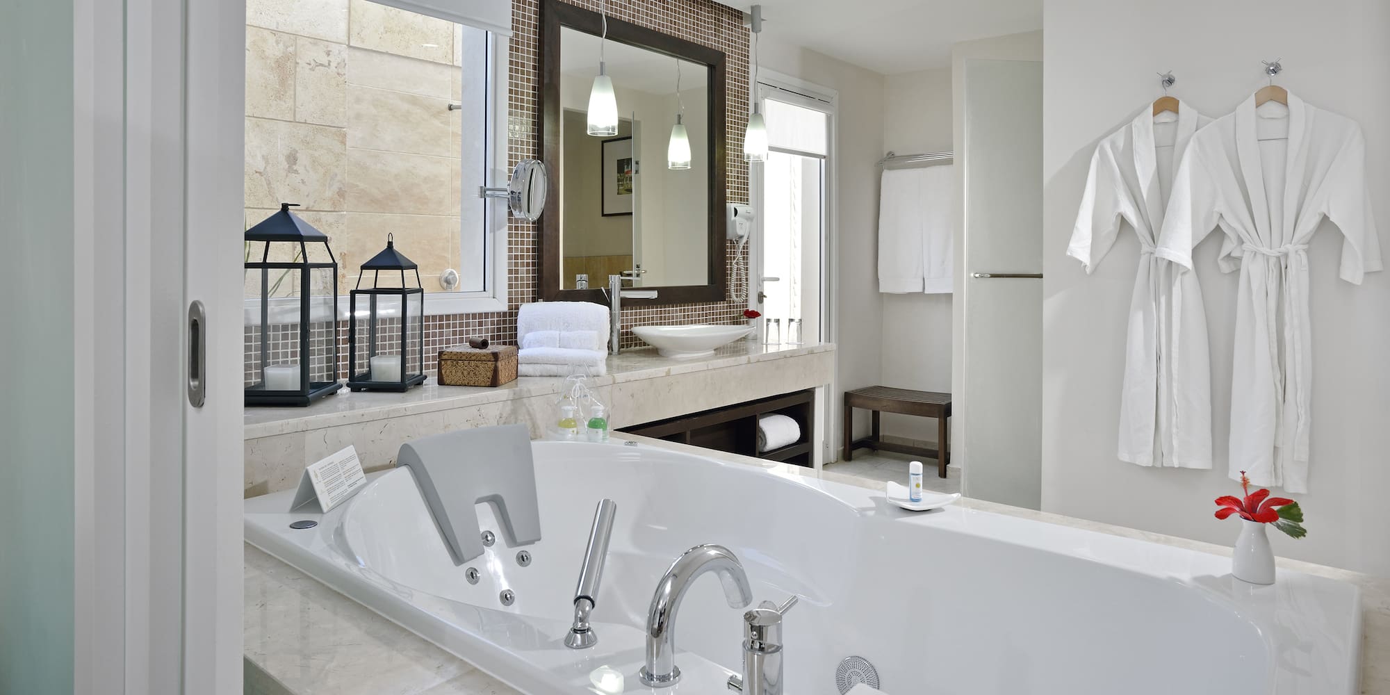 a bathroom with a bathtub and a mirror