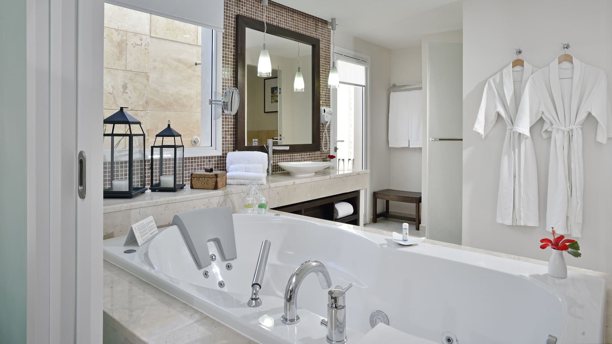 a bathroom with a bathtub and a mirror