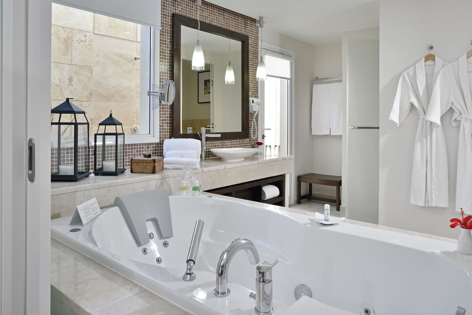 a bathroom with a bathtub and a mirror