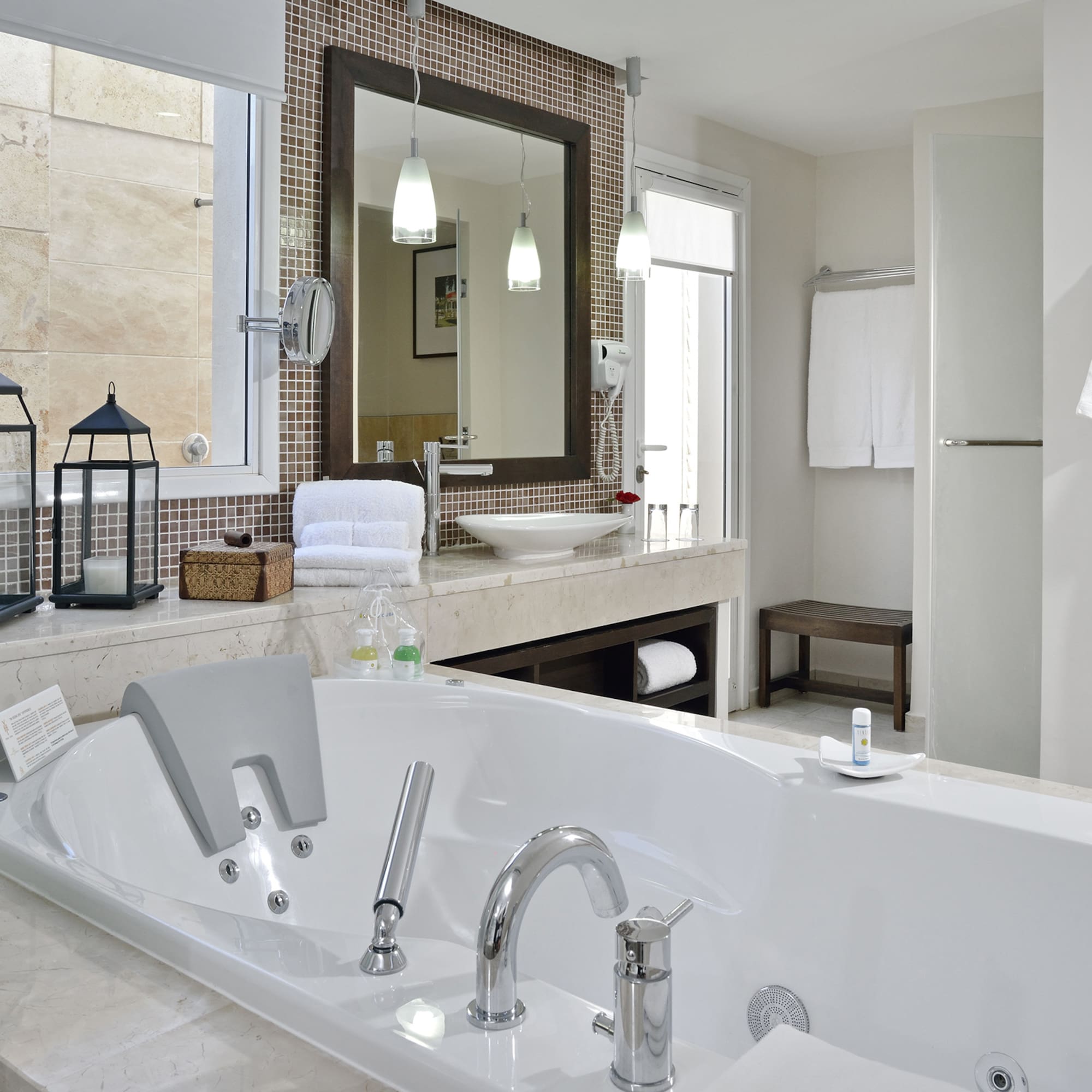 a bathroom with a bathtub and a mirror