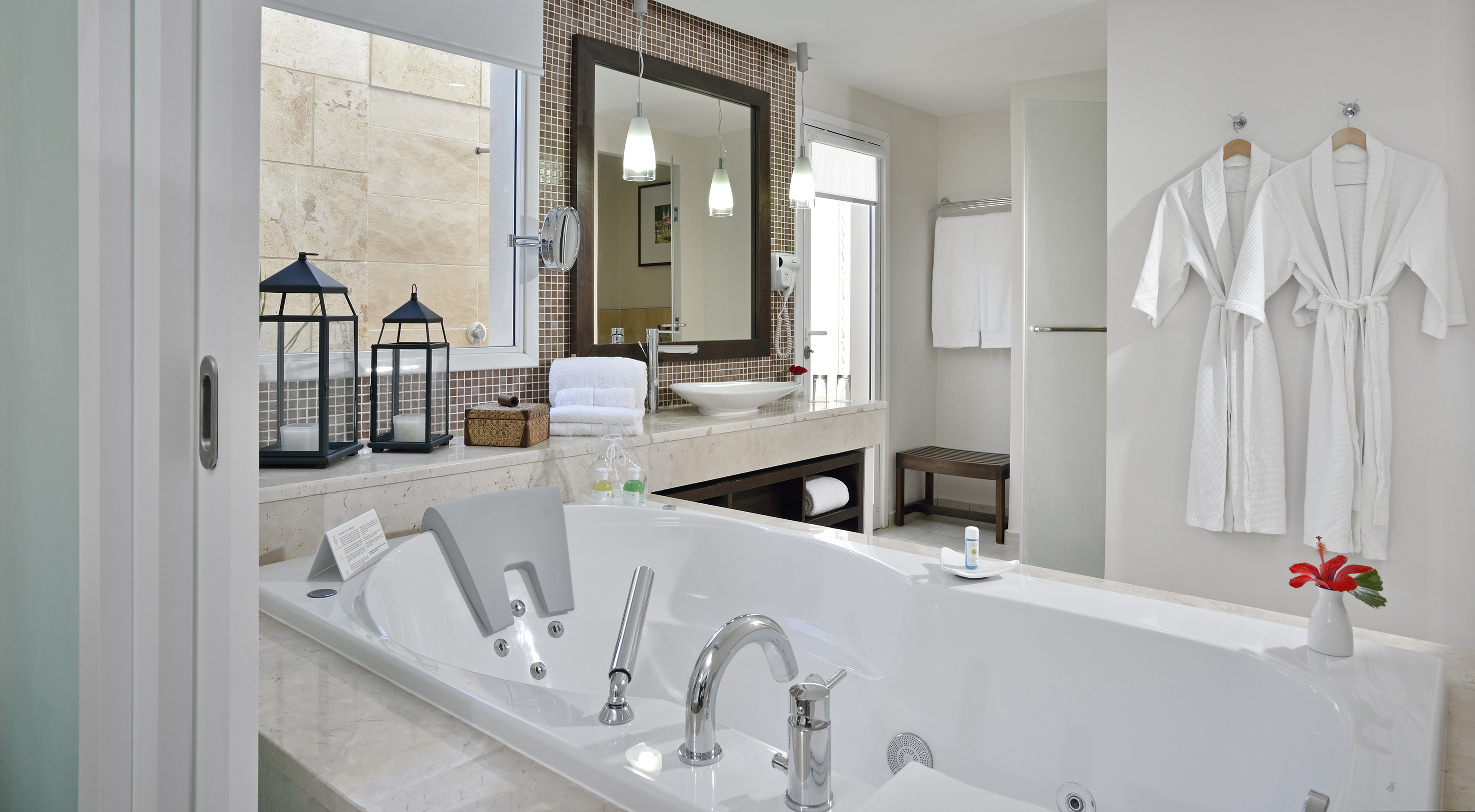 a bathroom with a bathtub and a mirror