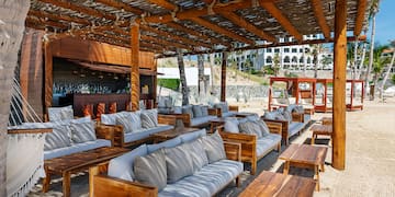 a lounge area with couches and tables