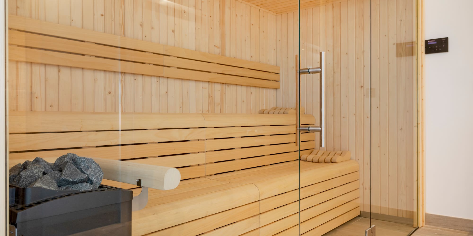 a wooden sauna with glass doors