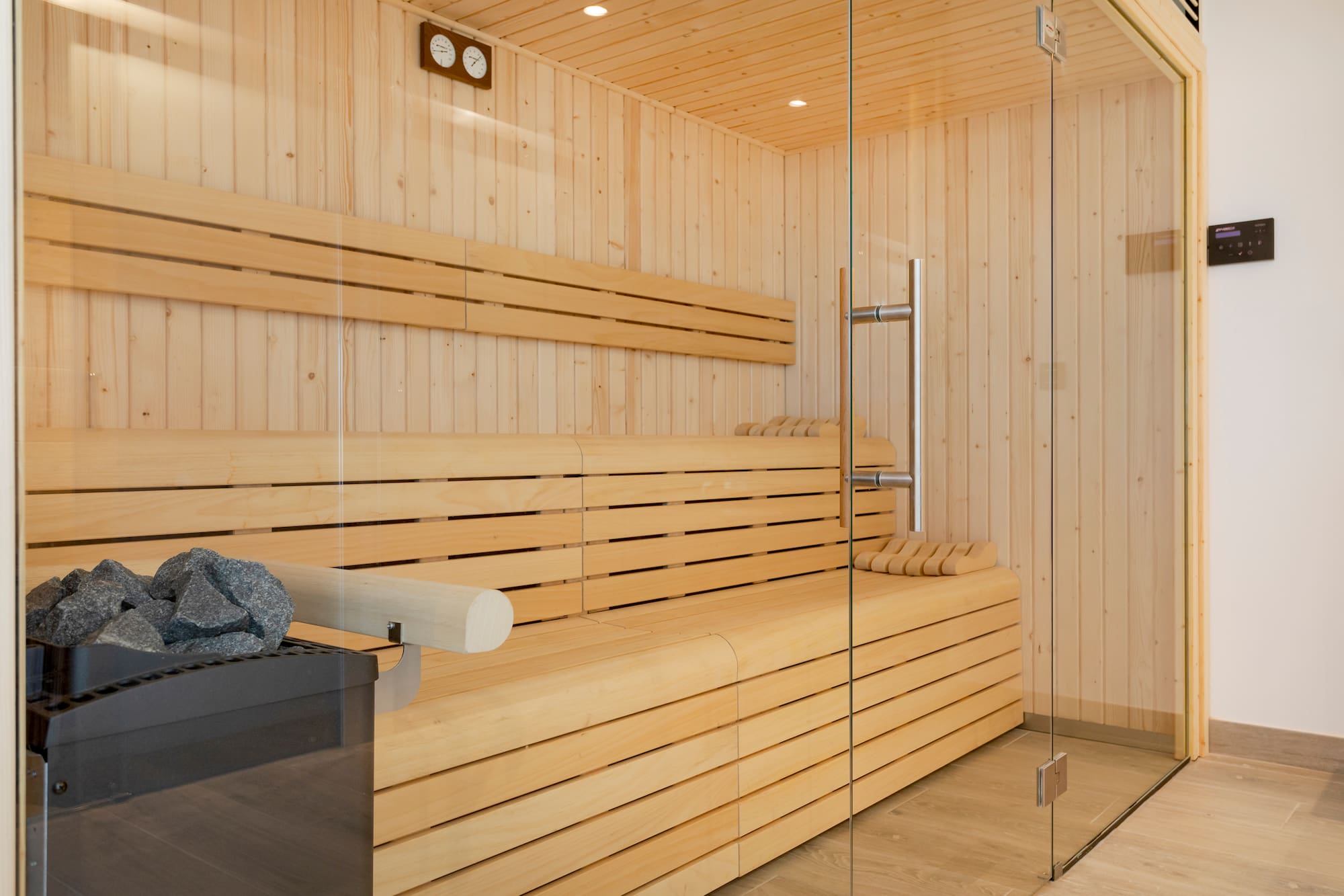 a wooden sauna with glass doors