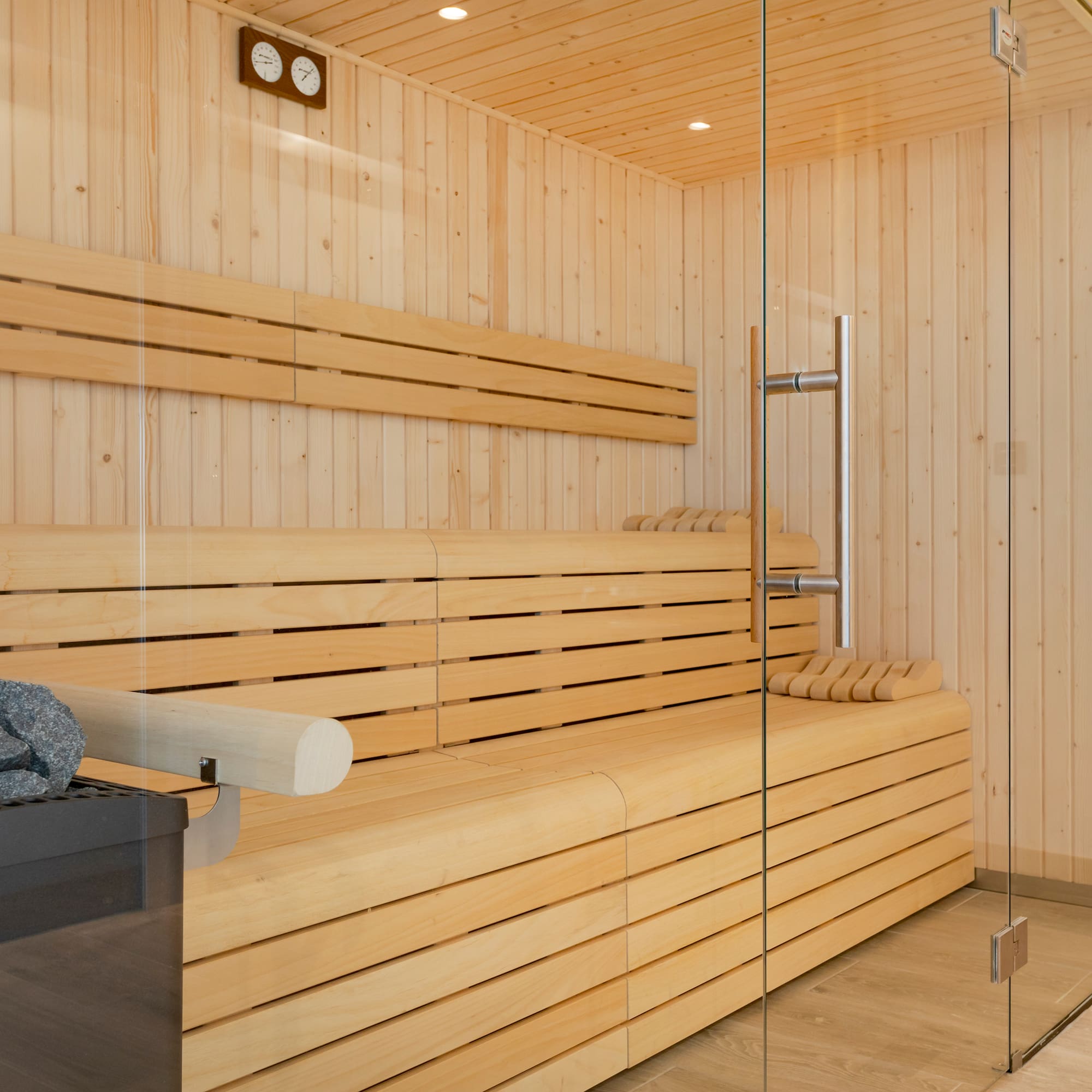 a wooden sauna with glass doors