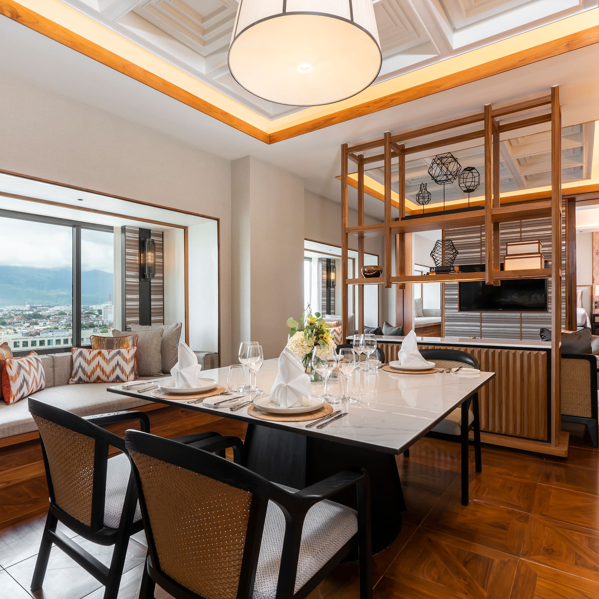 a dining room with a table and chairs