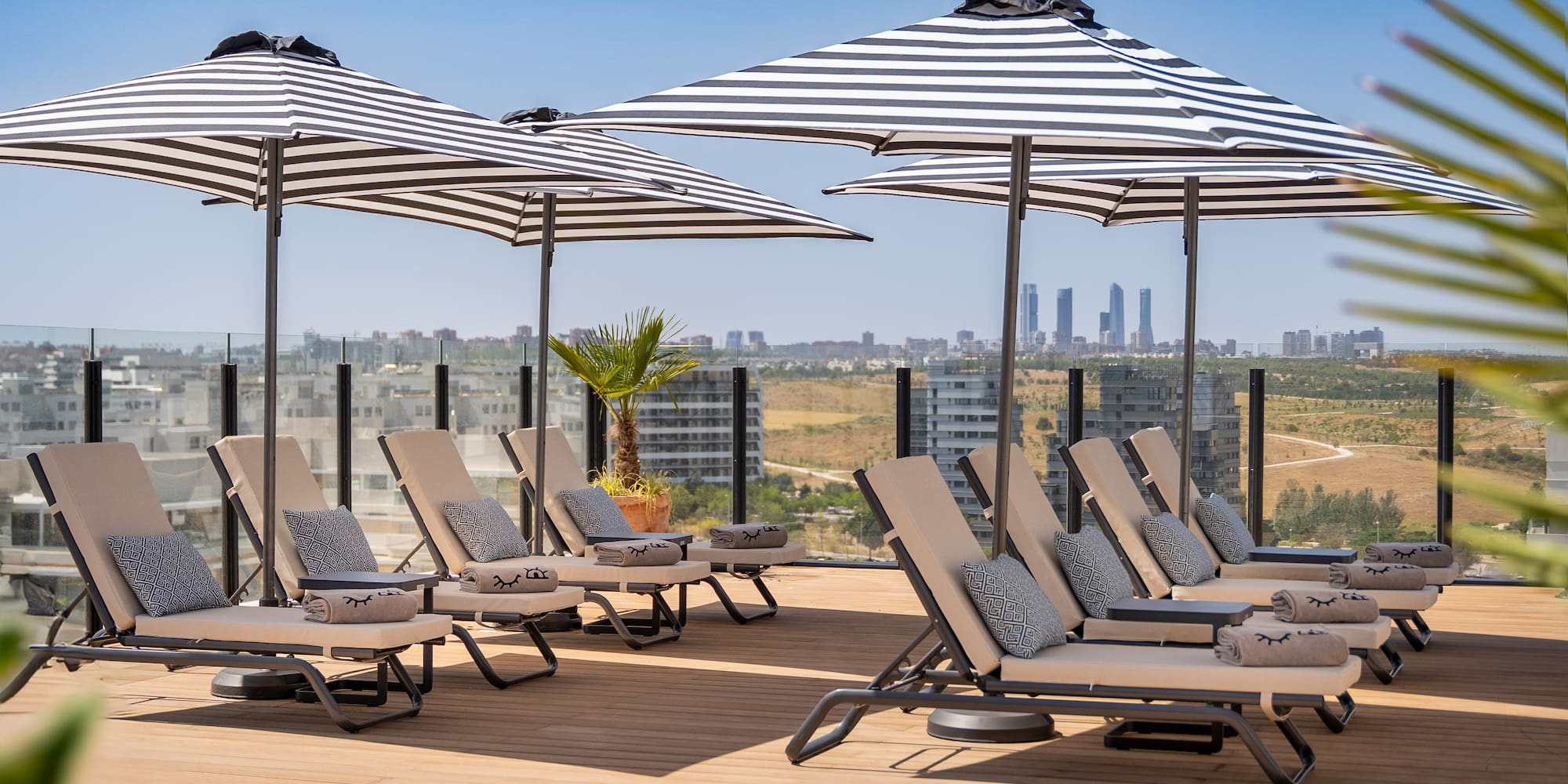a group of chairs and umbrellas on a deck