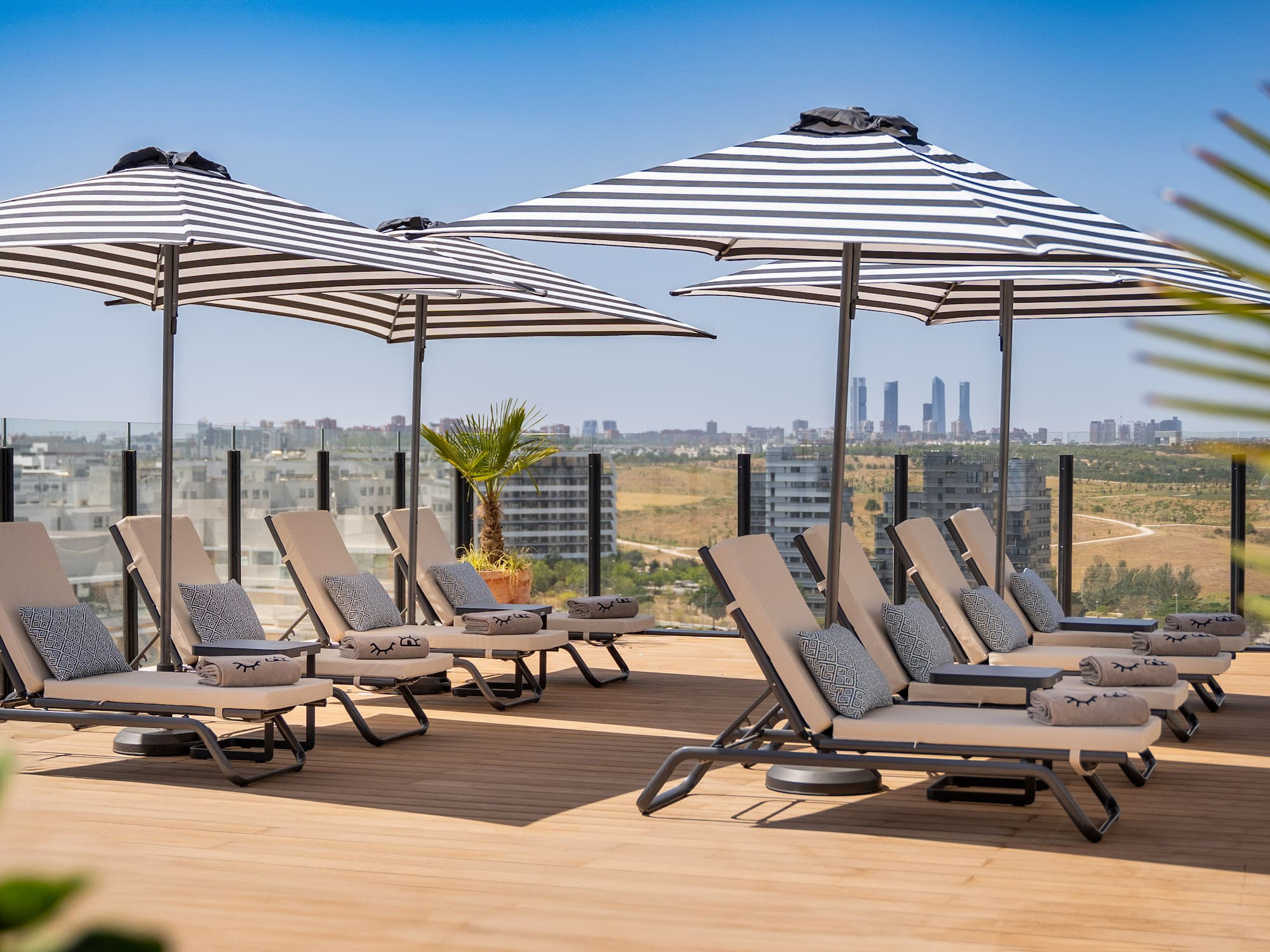 a group of chairs and umbrellas on a deck