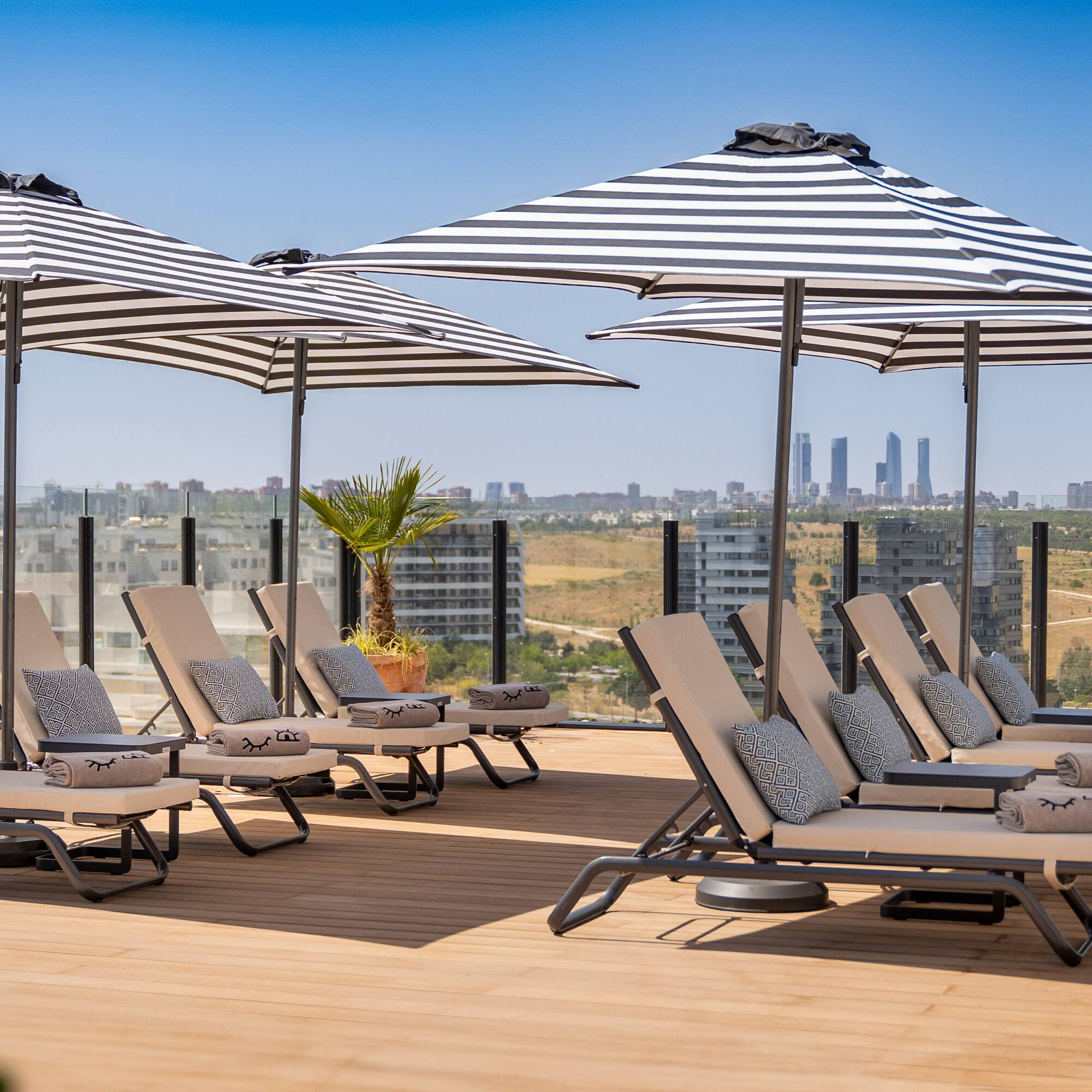 a group of chairs and umbrellas on a deck
