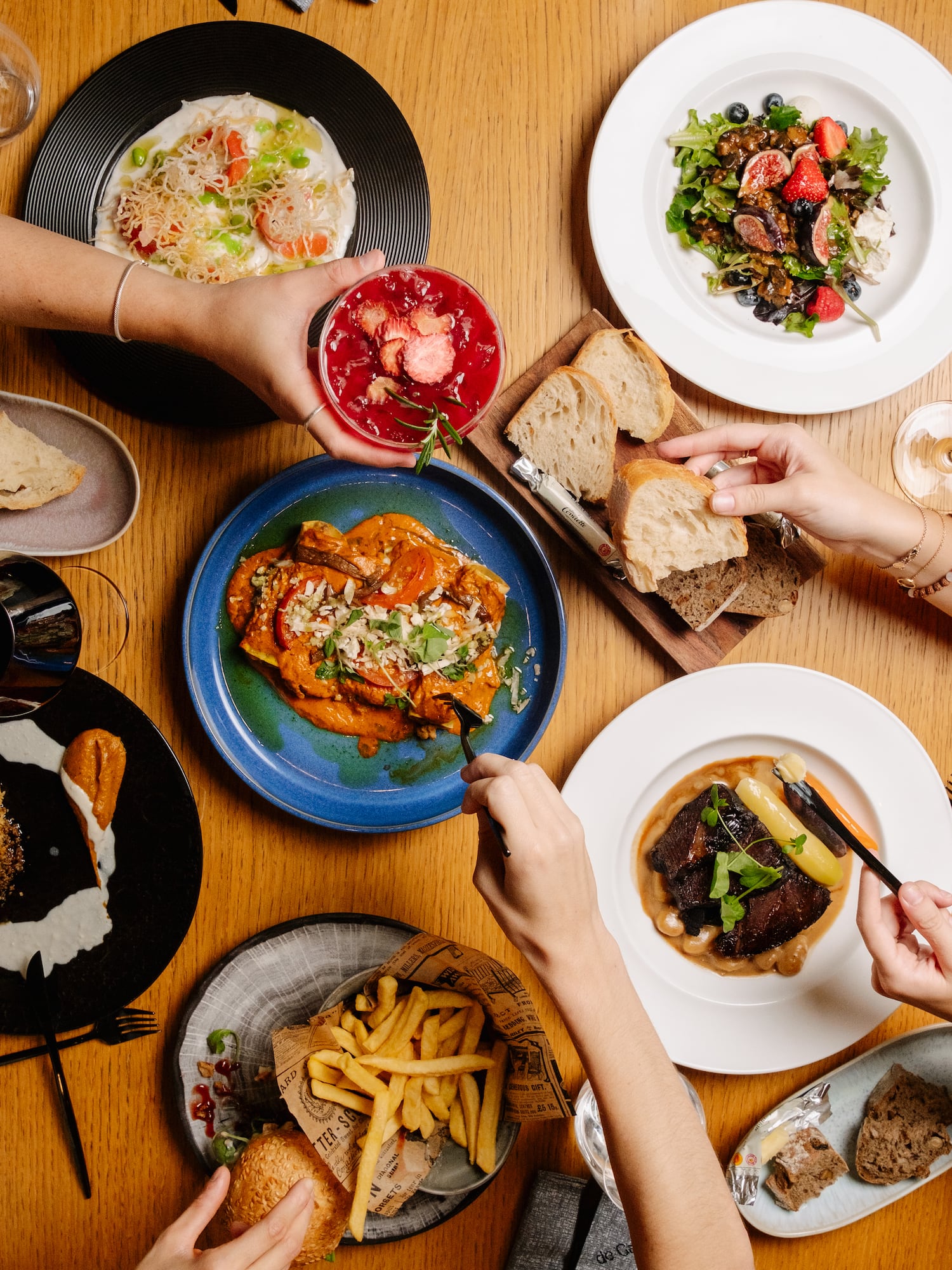 a group of people eating food on a table