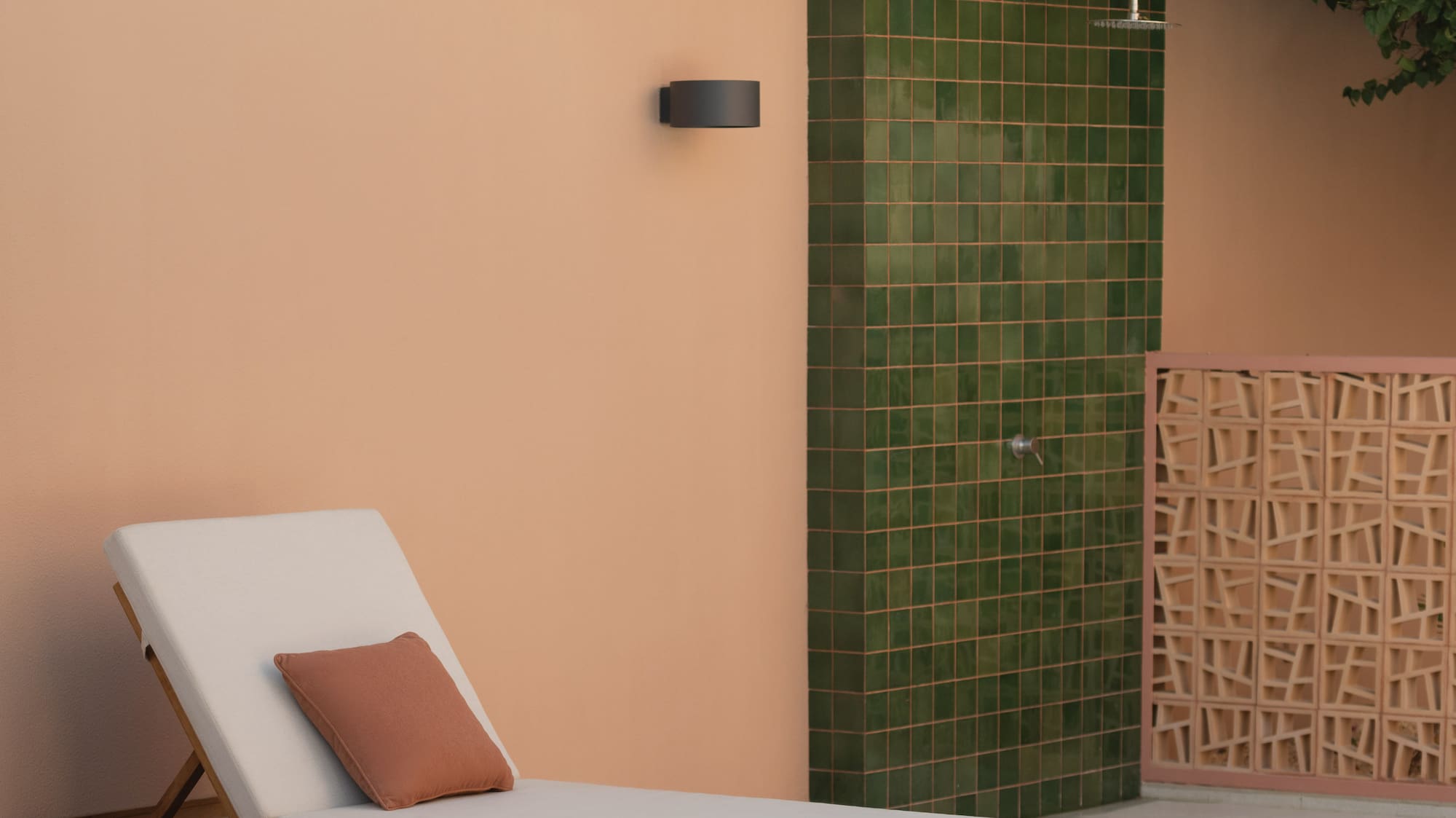 a lounge chairs outside a shower