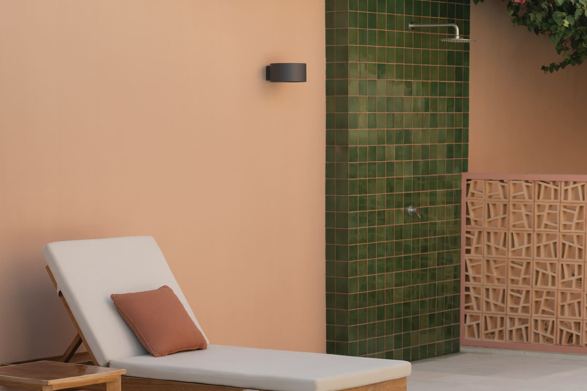 a lounge chairs outside a shower