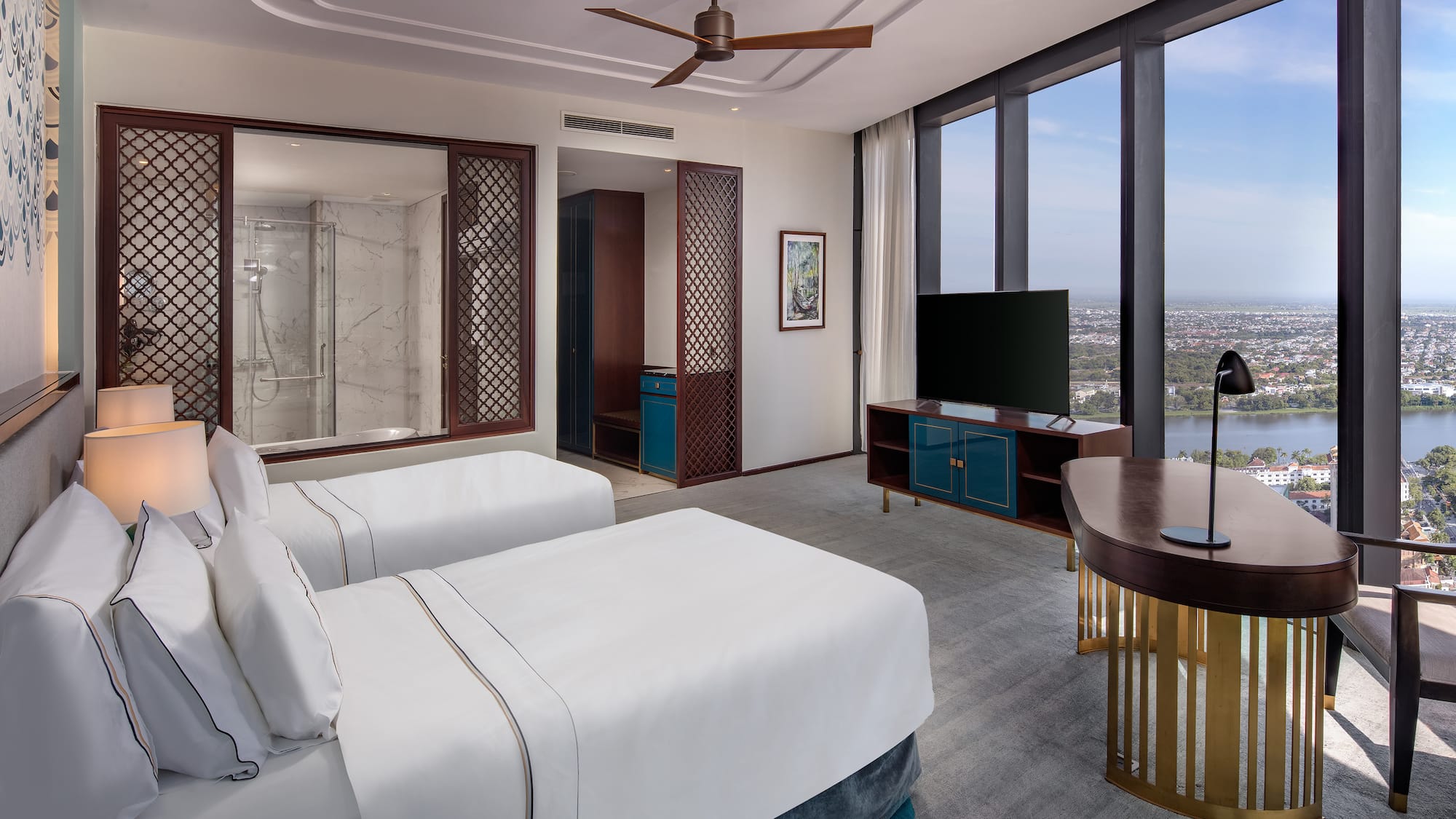 a room with two beds and a television