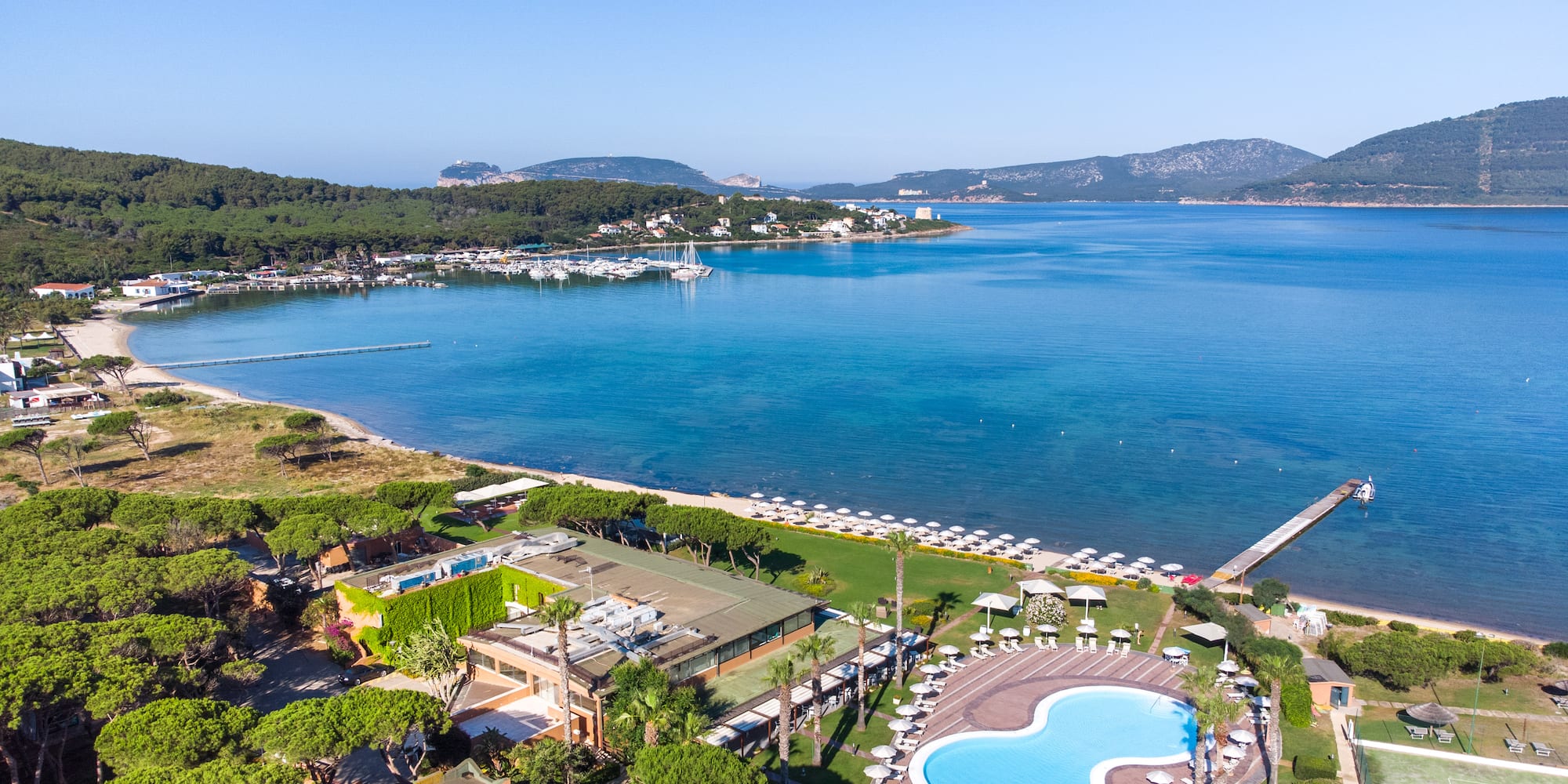 a swimming pool next to a body of water