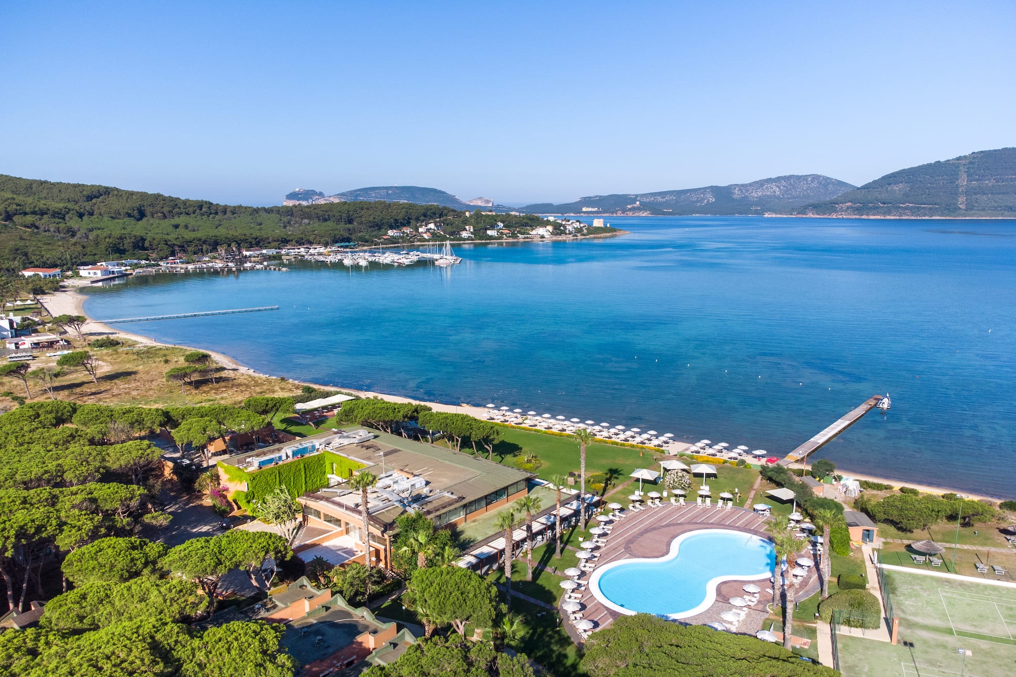 a swimming pool next to a body of water