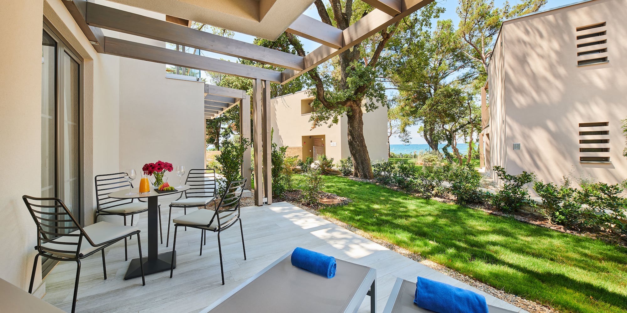 a patio with chairs and a table